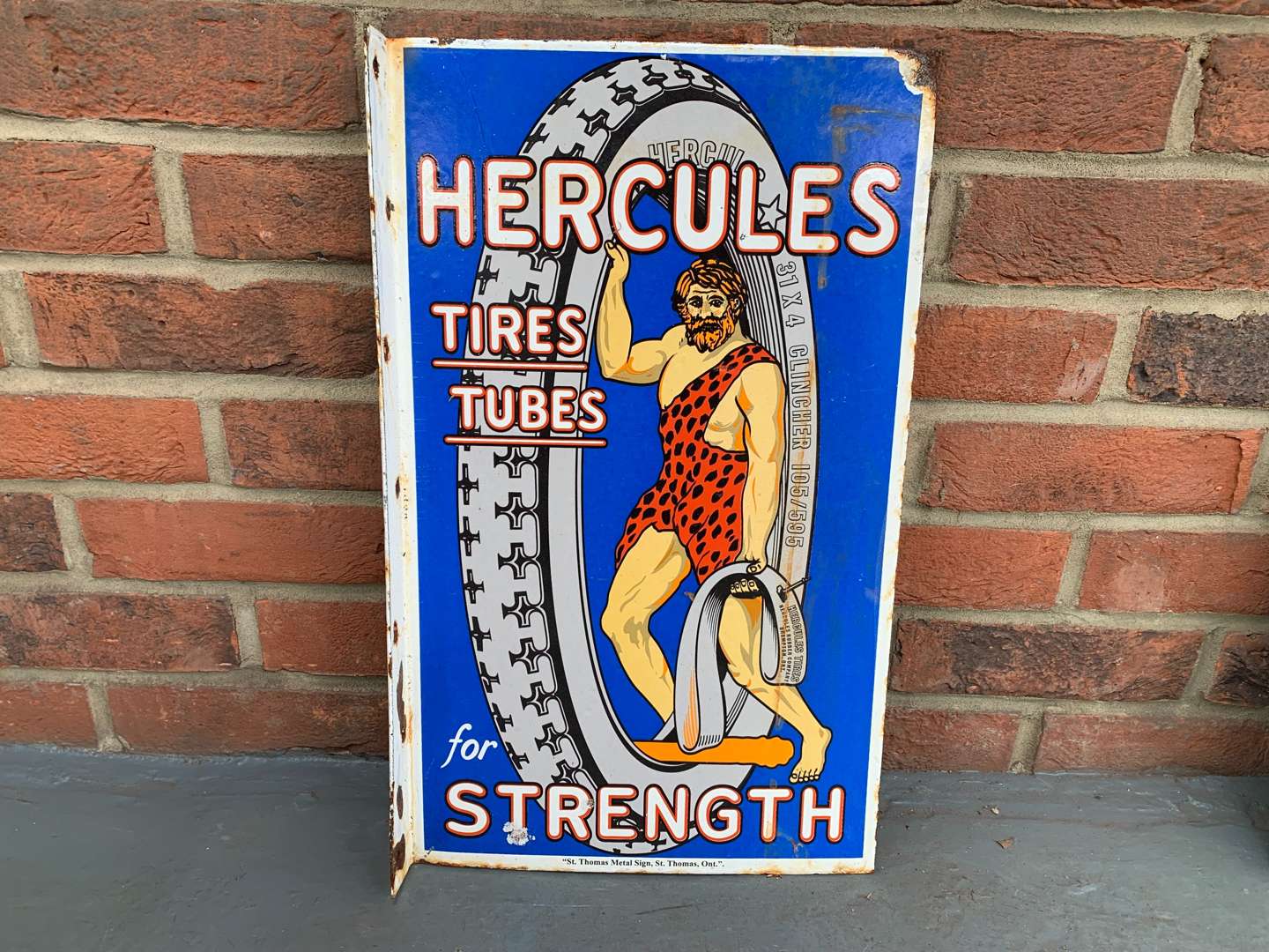 <p>Enamel Hercules Tire Tubes Flanged Sign</p>