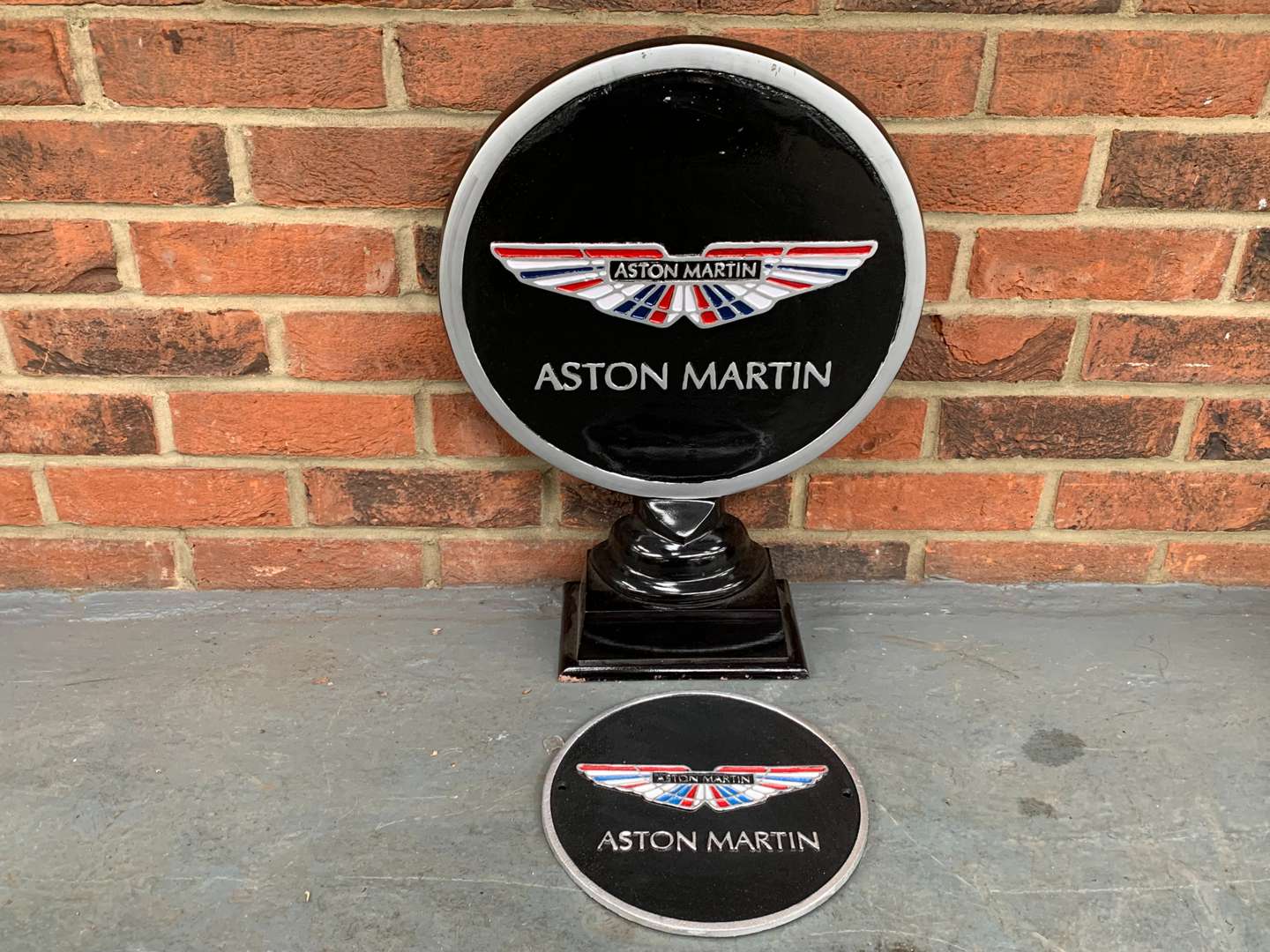 <p>Modern Cast Aluminium Aston Martin Display and Cast Iron Plaque (2)</p>