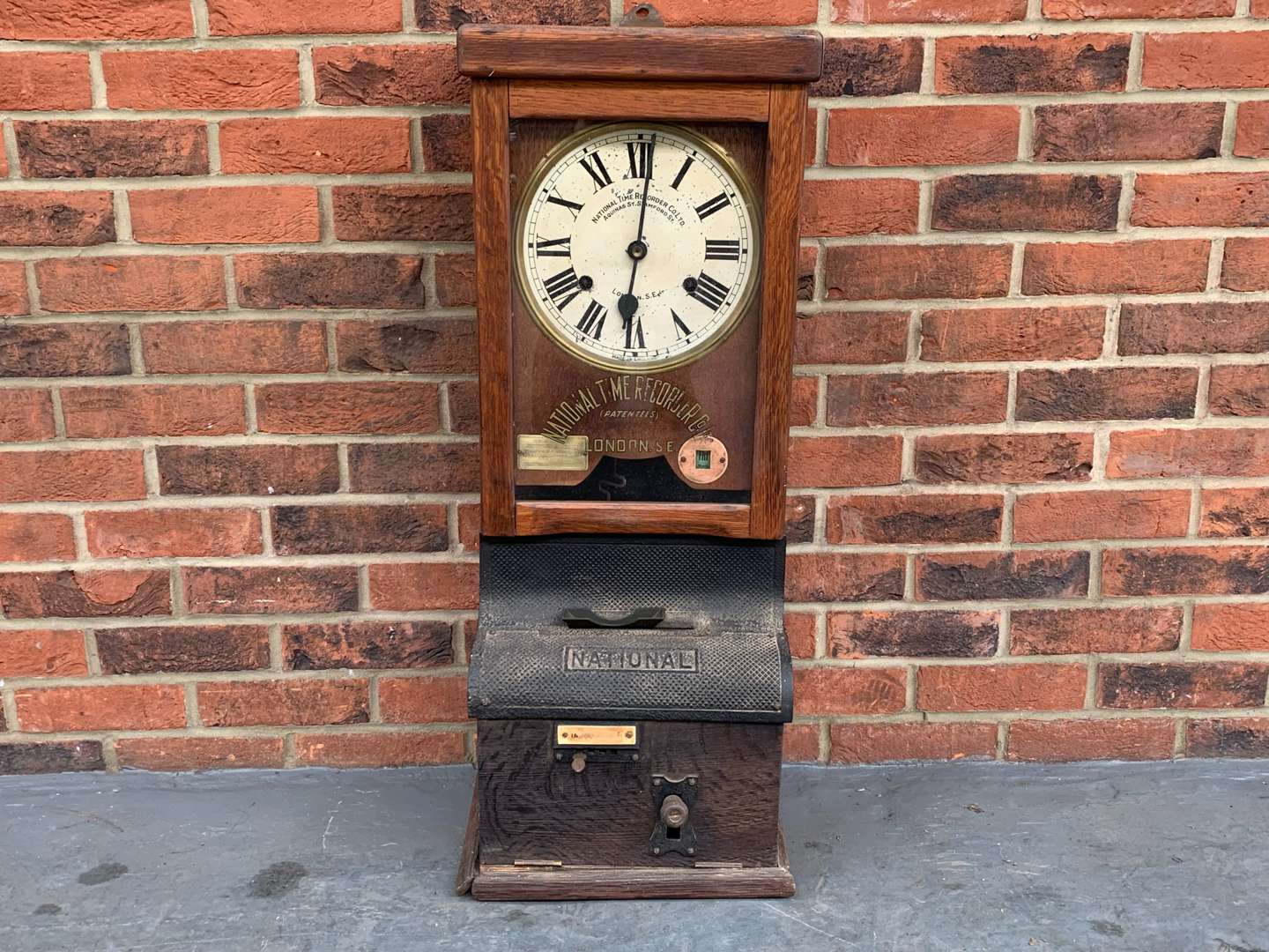 <p>Oak Framed National Time Recorder Co Clock</p>