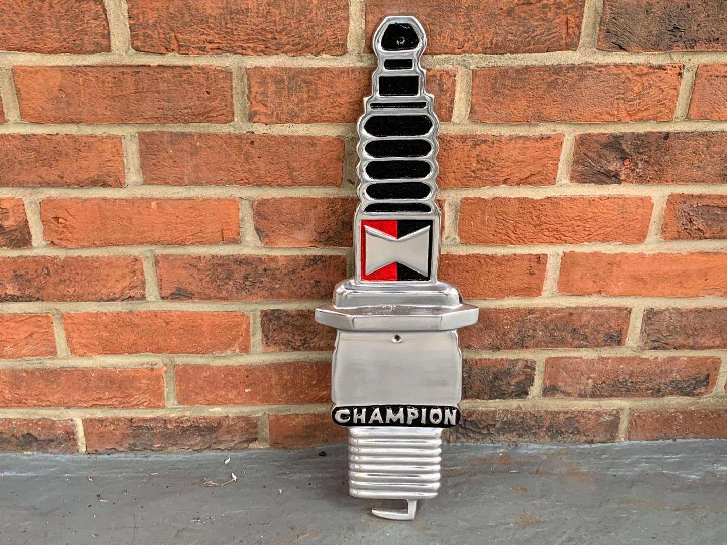 <p>Cast Aluminium Champion Spark Plug Sign</p>