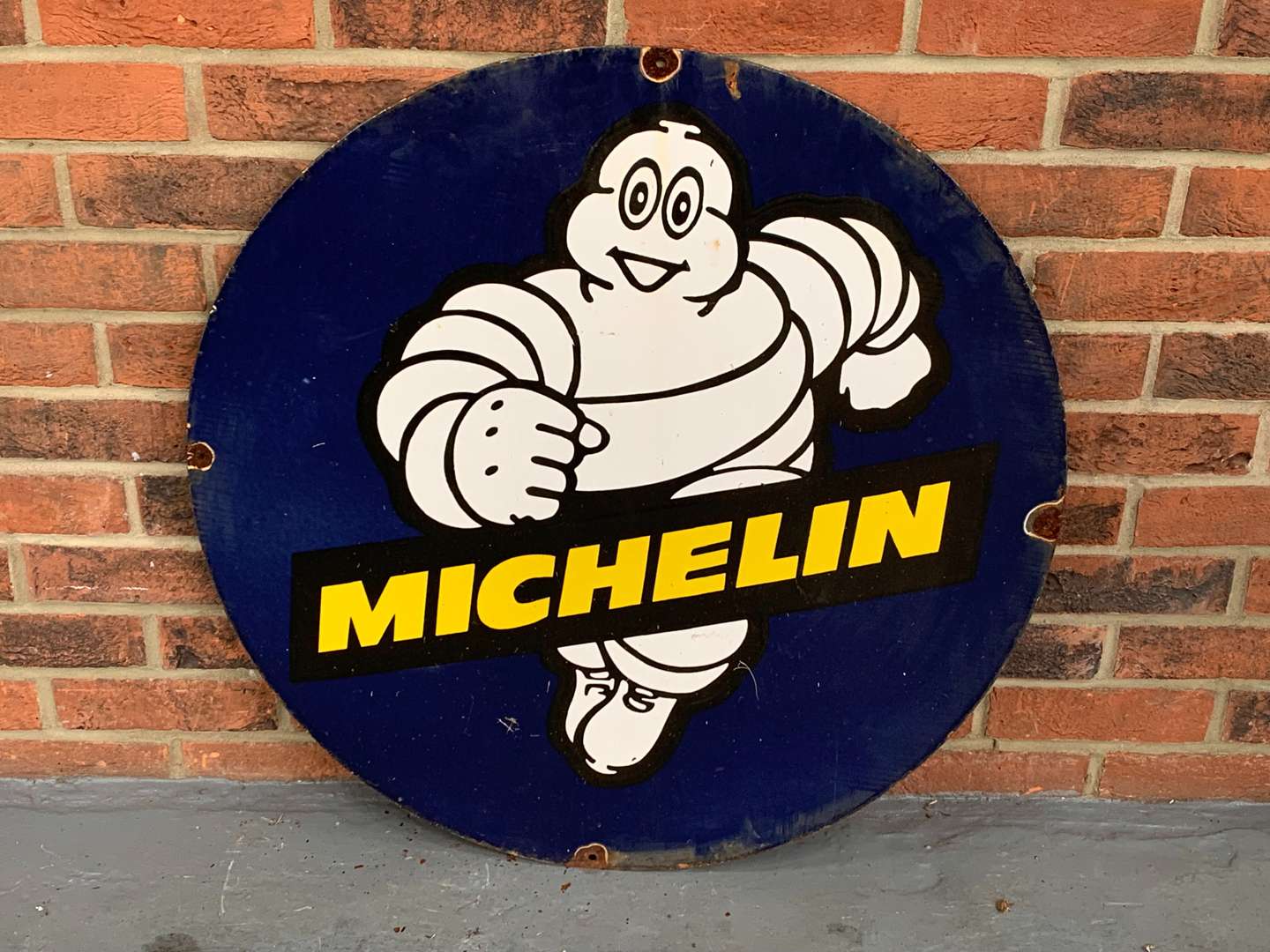 <p>Enamel Michelin Running Man Circular Sign</p>