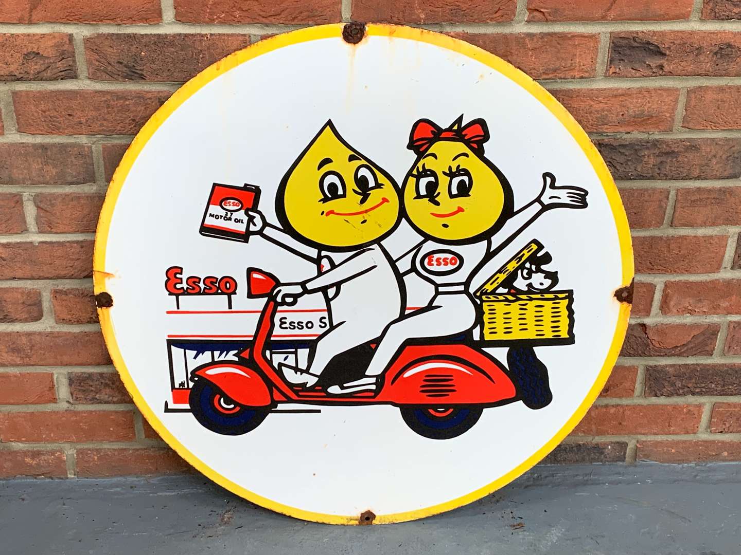 <p>Enamel Mr and Mrs Drip on Scooter Sign</p>