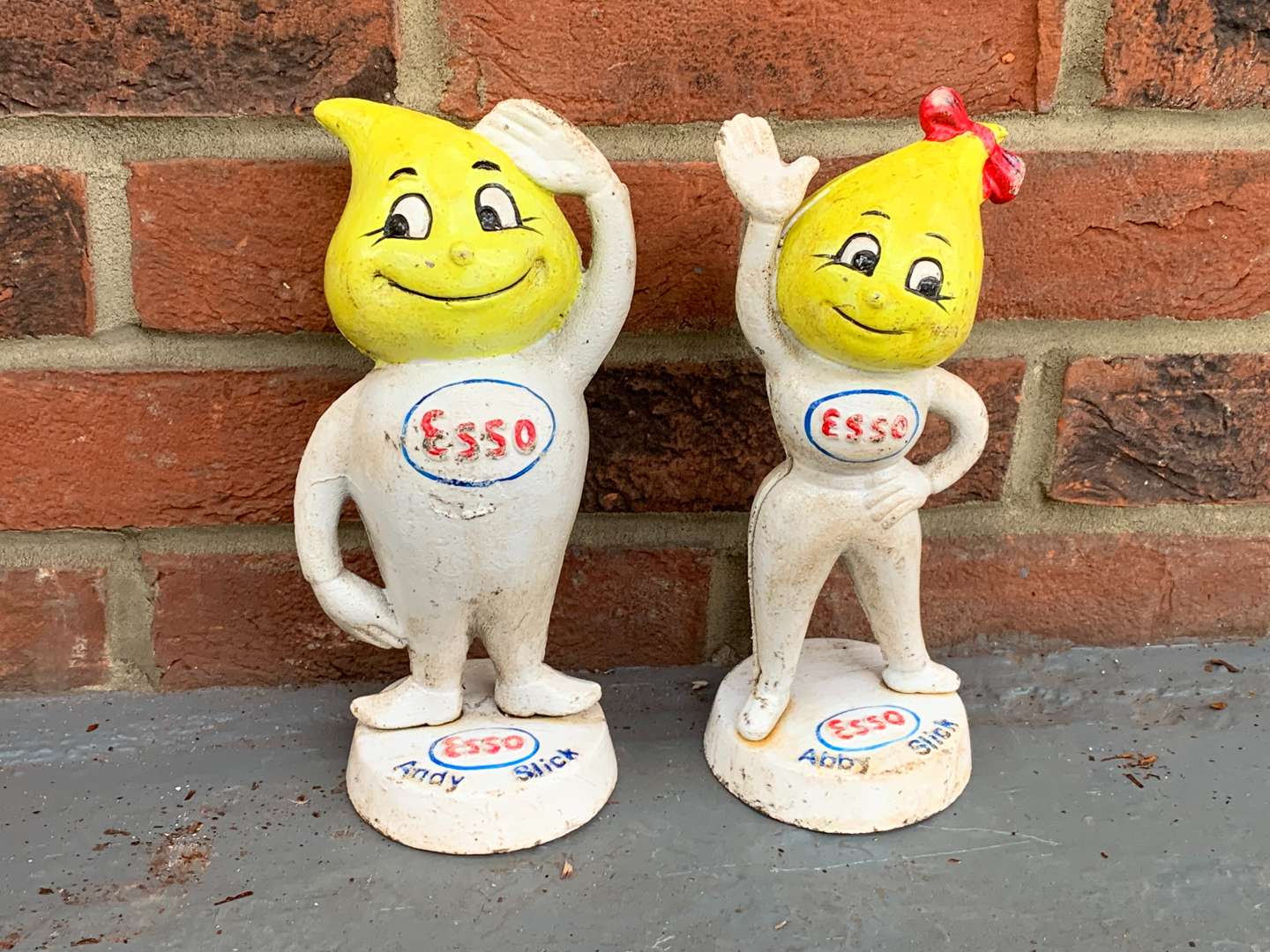 <p>Cast Iron Esso Andy and Abby Slick Figures</p>