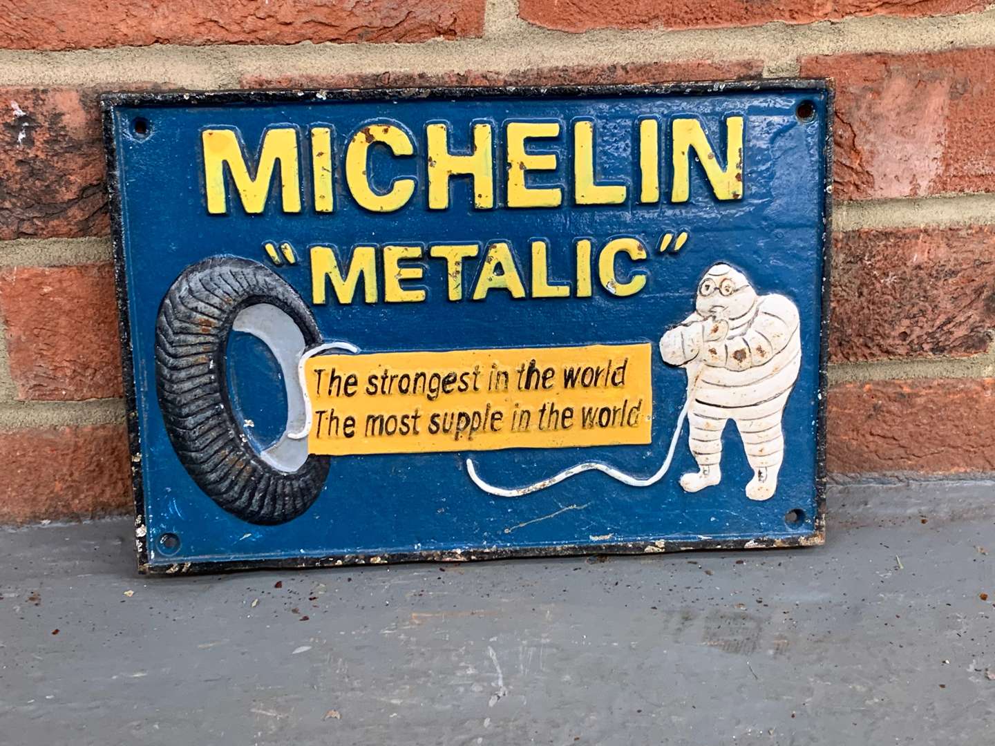 <p>Cast Iron Michelin Metalic Tyres Sign</p>