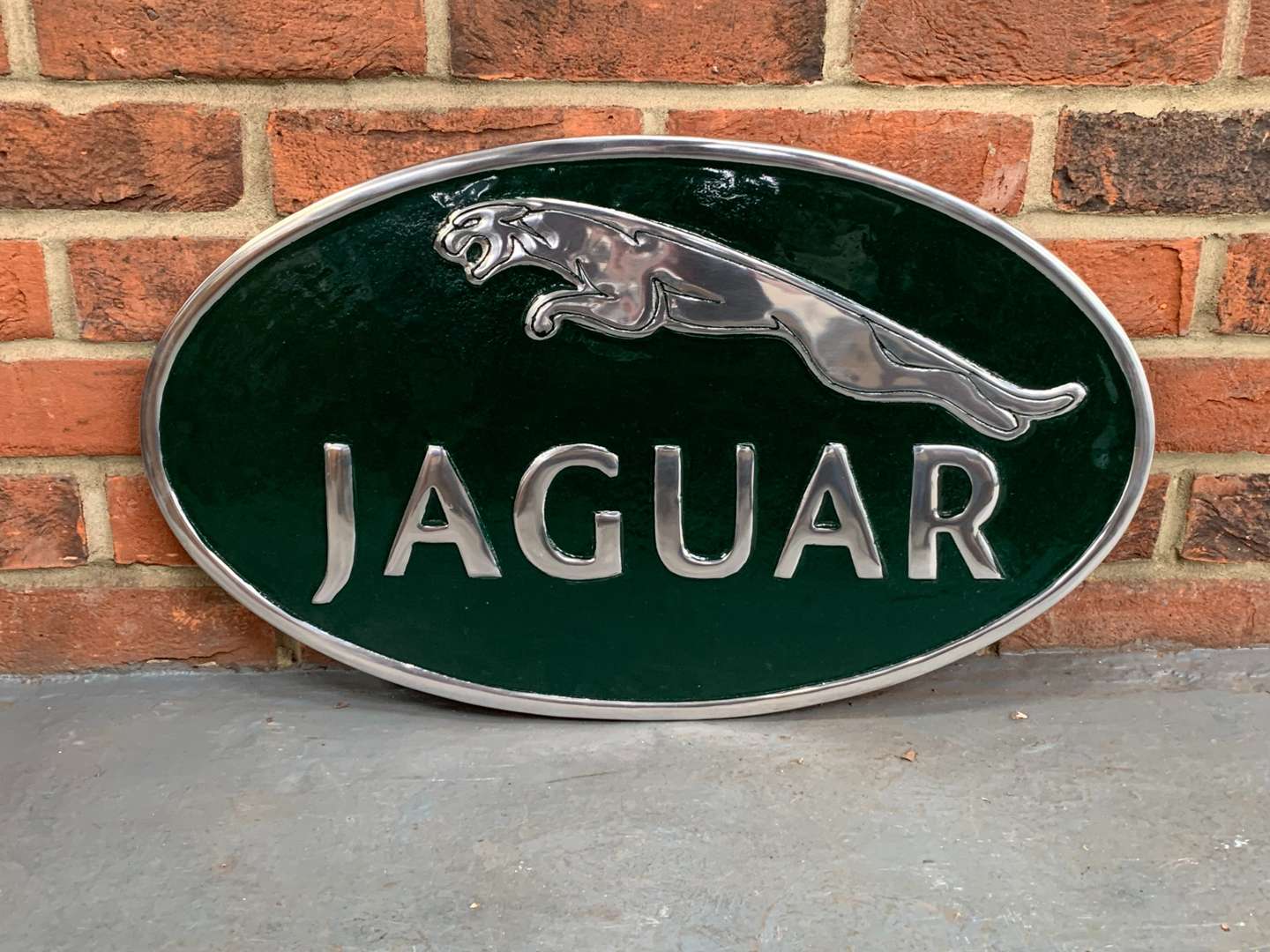 <p>Cast Aluminium Oval Jaguar Sign</p>