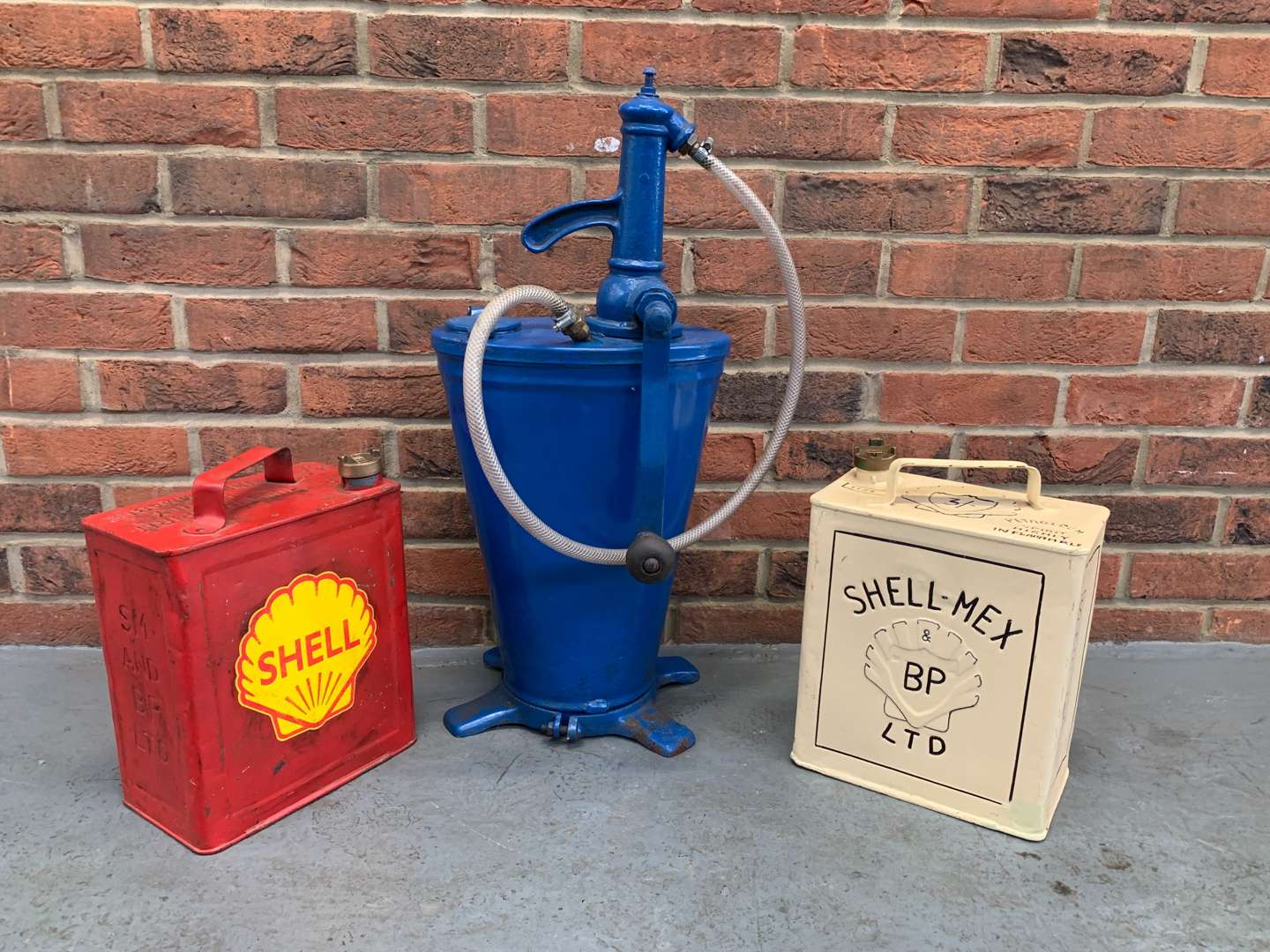 <p>Forecourt Oil Dispenser and Two Five Gallon Fuel Cans (3)</p>