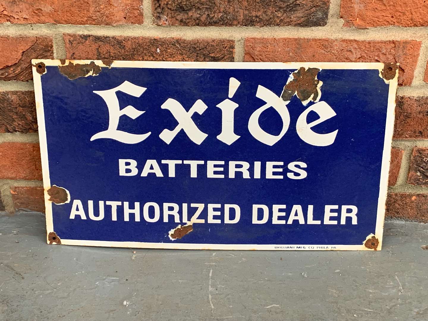 <p>Enamel Exide Batteries Authorized Dealer Sign</p>