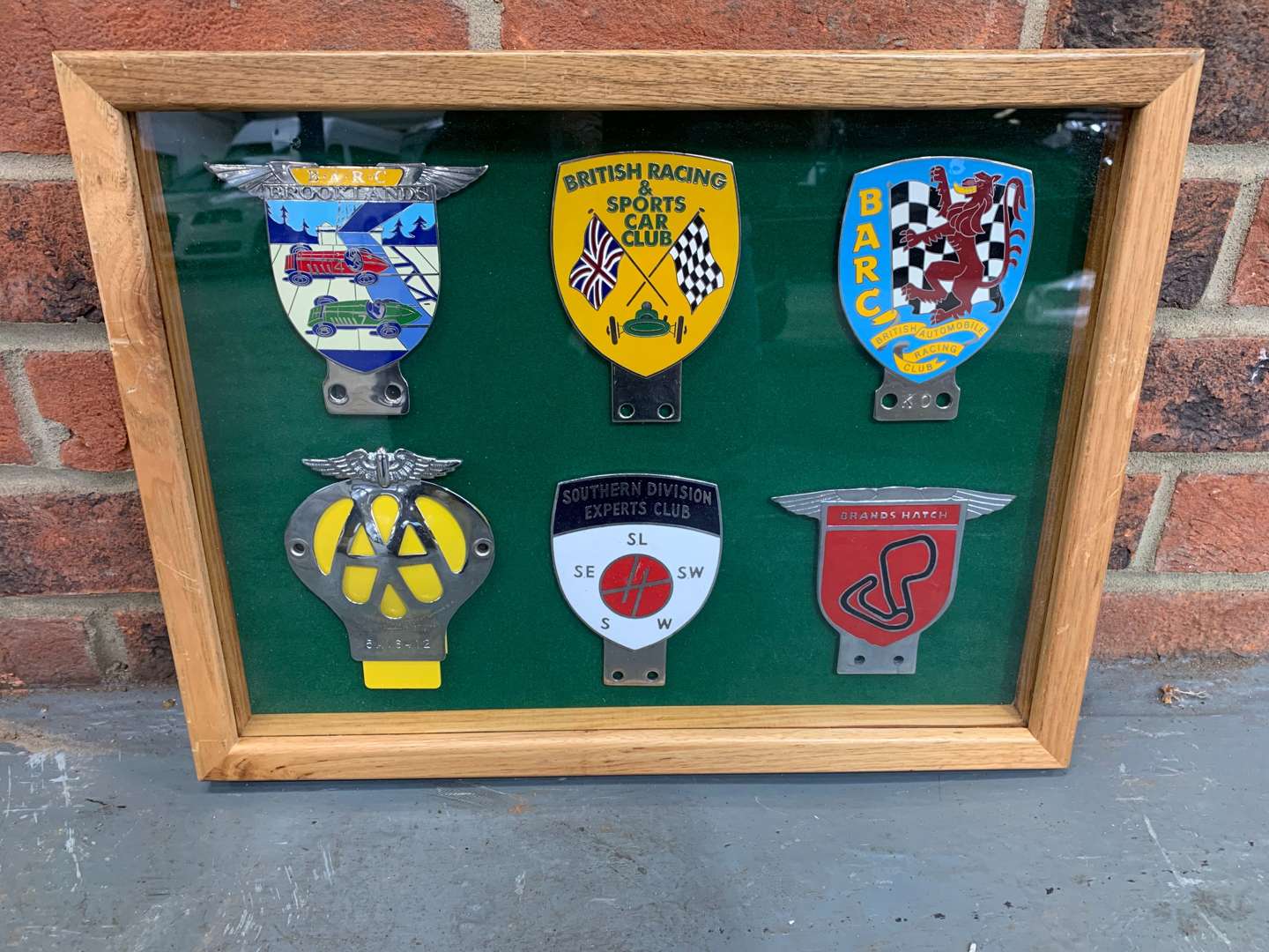 <p>Oak Cased Set of Six Motoring Badges&nbsp;</p>