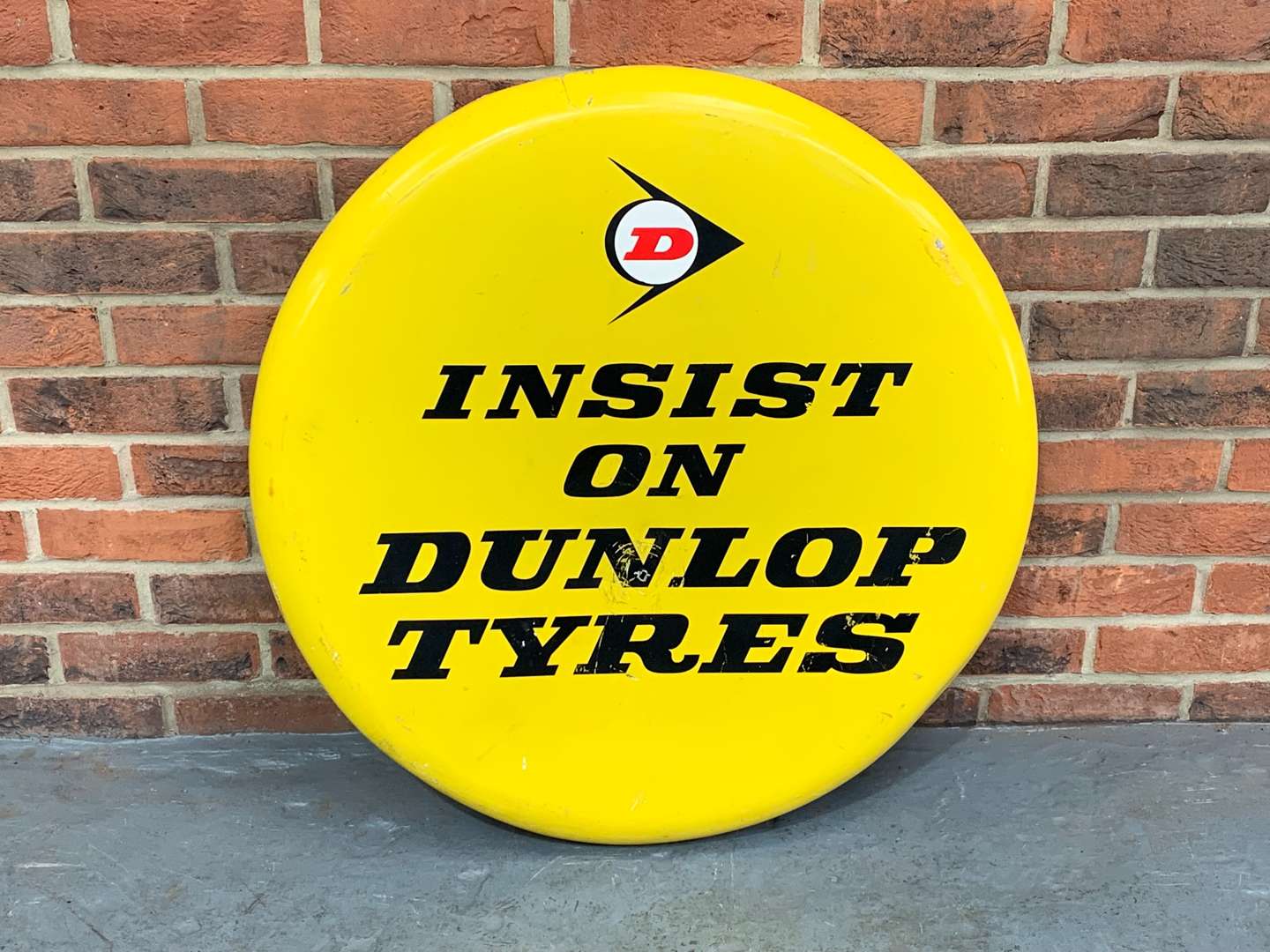 <p>Large Aluminium “Insist on Dunlop Tyre's” Circular Sign</p>