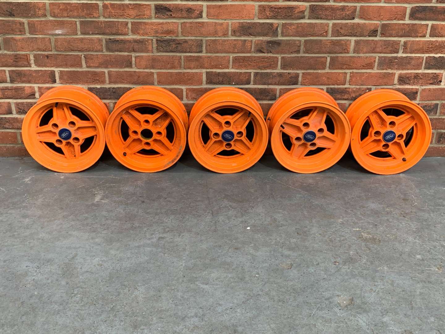 <p>Set of Five Orange Ford Alloy Wheels</p>