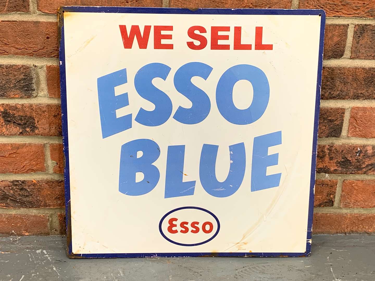 <p>Metal “We Sell Esso Blue” Sign</p>