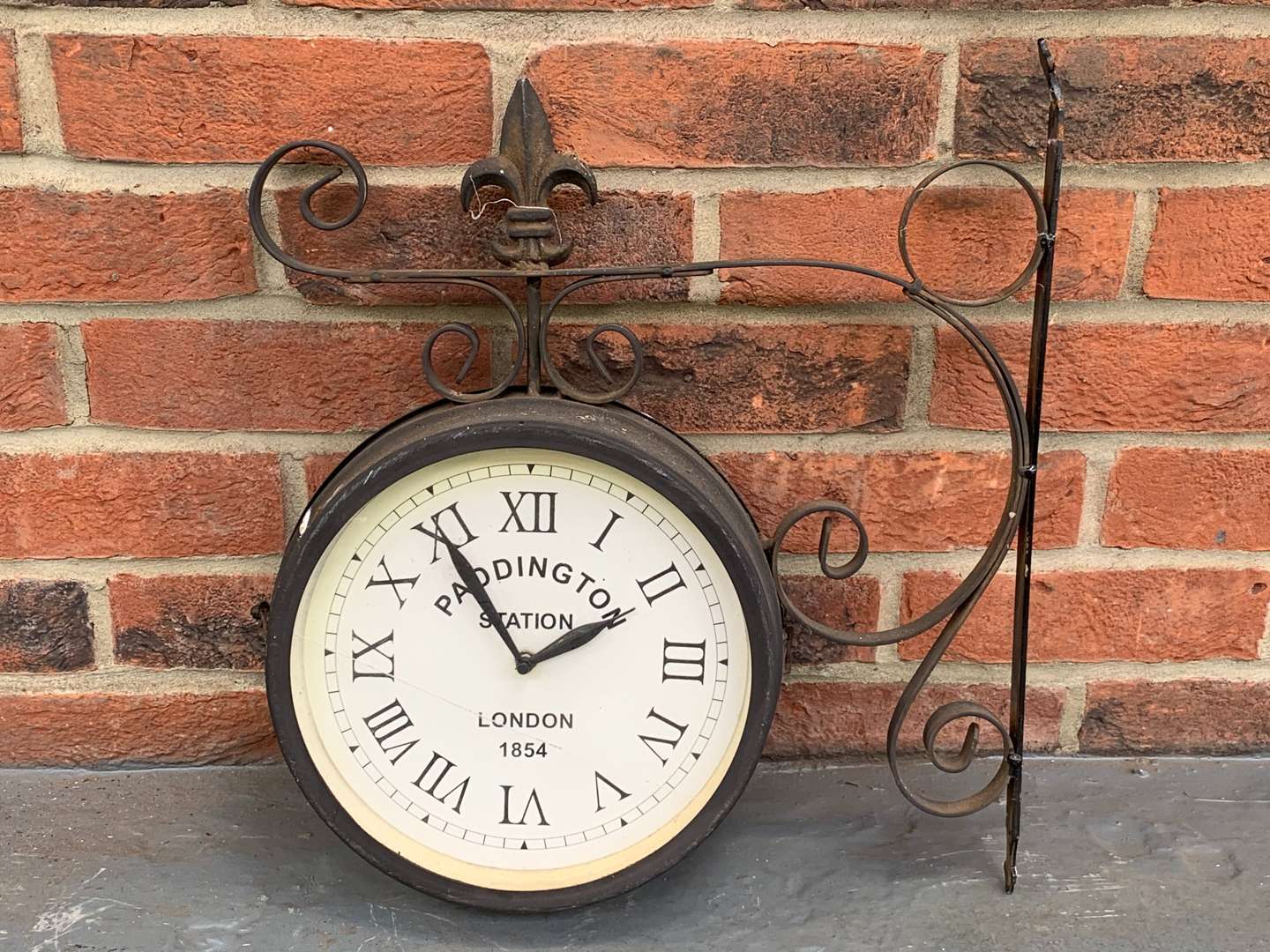 <p>Metal Wall Mounted Paddington Station Clock</p>