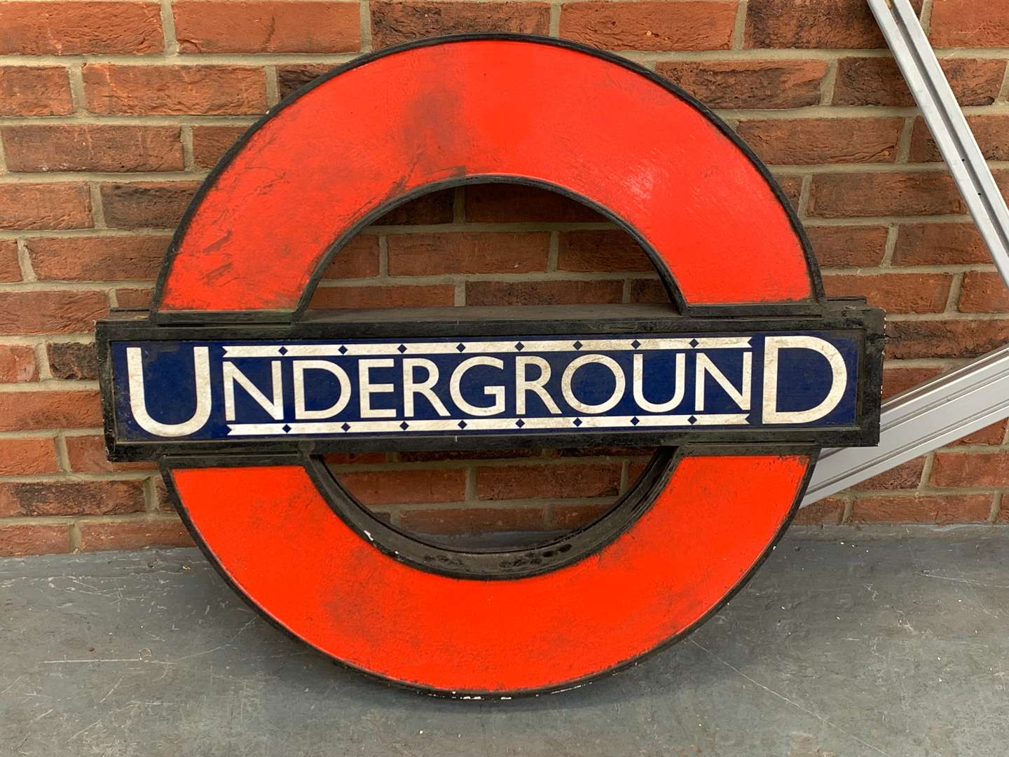 <p>Painted Wooden Wall Mounted Underground Sign and Bracket&nbsp;</p>