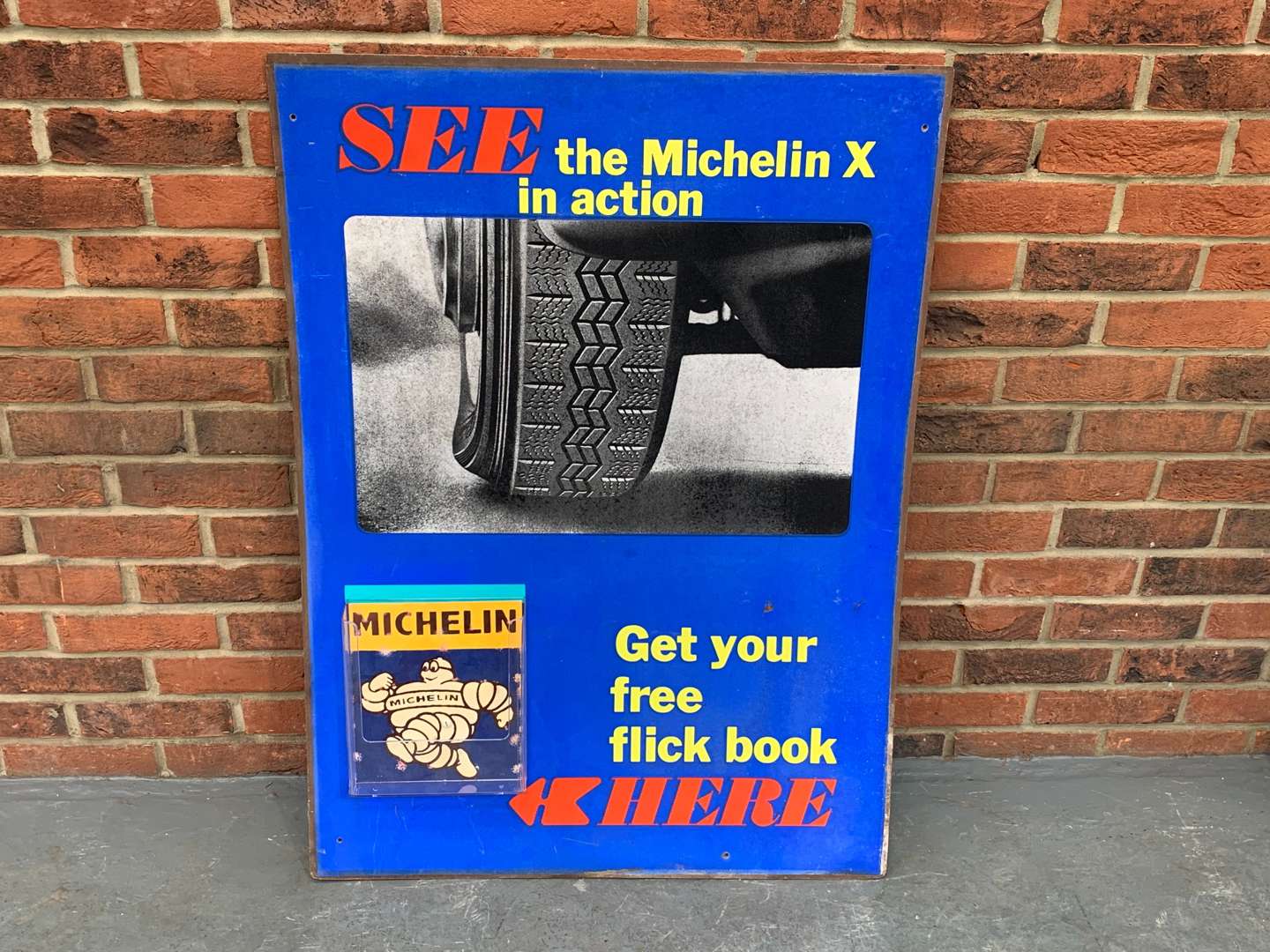 <p>Michelin X In Action “Get Your Free Flick Book Here” Sign on Board</p>
