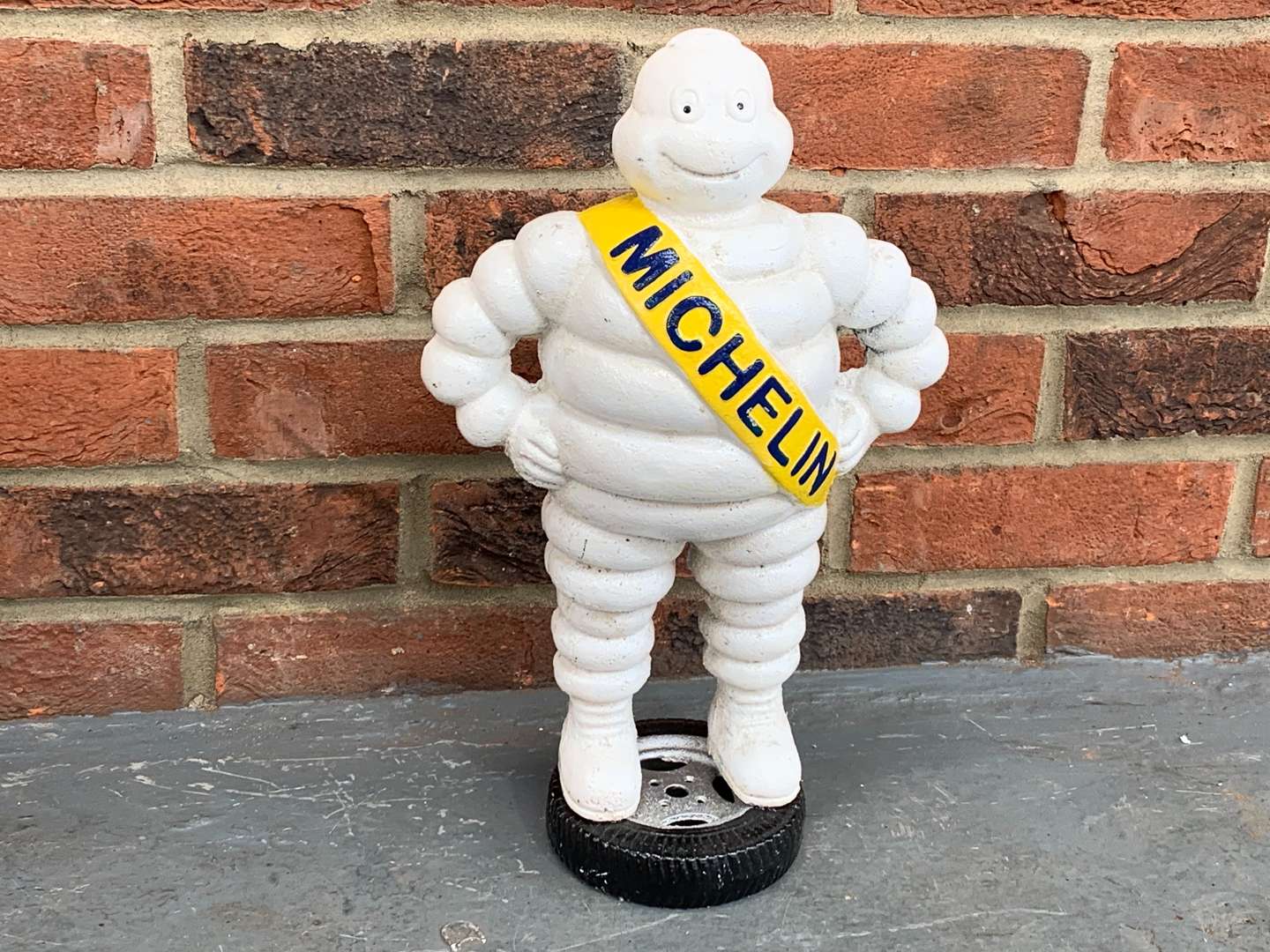 <p>Cast Iron Michelin Man Standing on a Tyre</p>