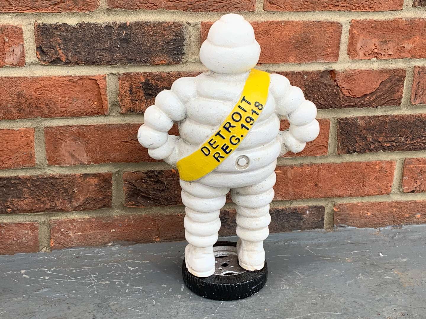 <p>Cast Iron Michelin Man Standing on a Tyre</p>