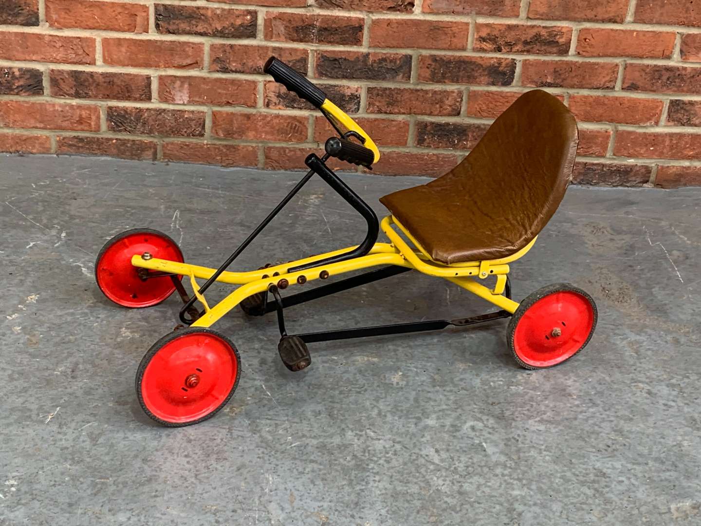 <p>Child's Tubular Metal Pedal Car</p>