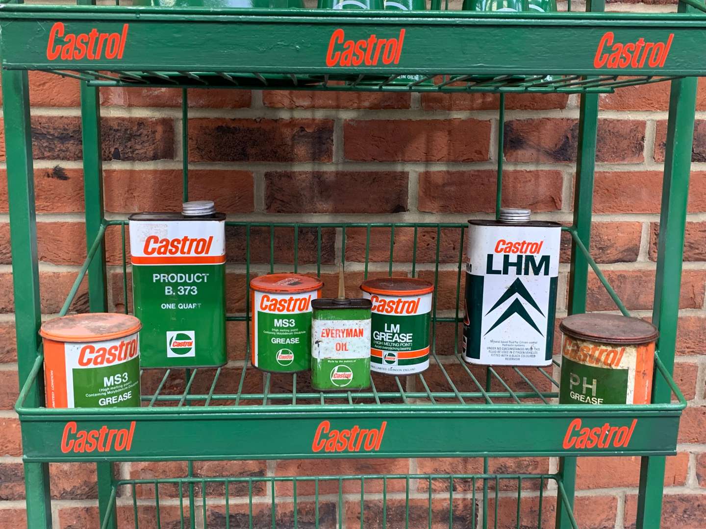 <p>Castrol Wire Work Display Rack and a Quantity of Oil Cans and Jugs</p>