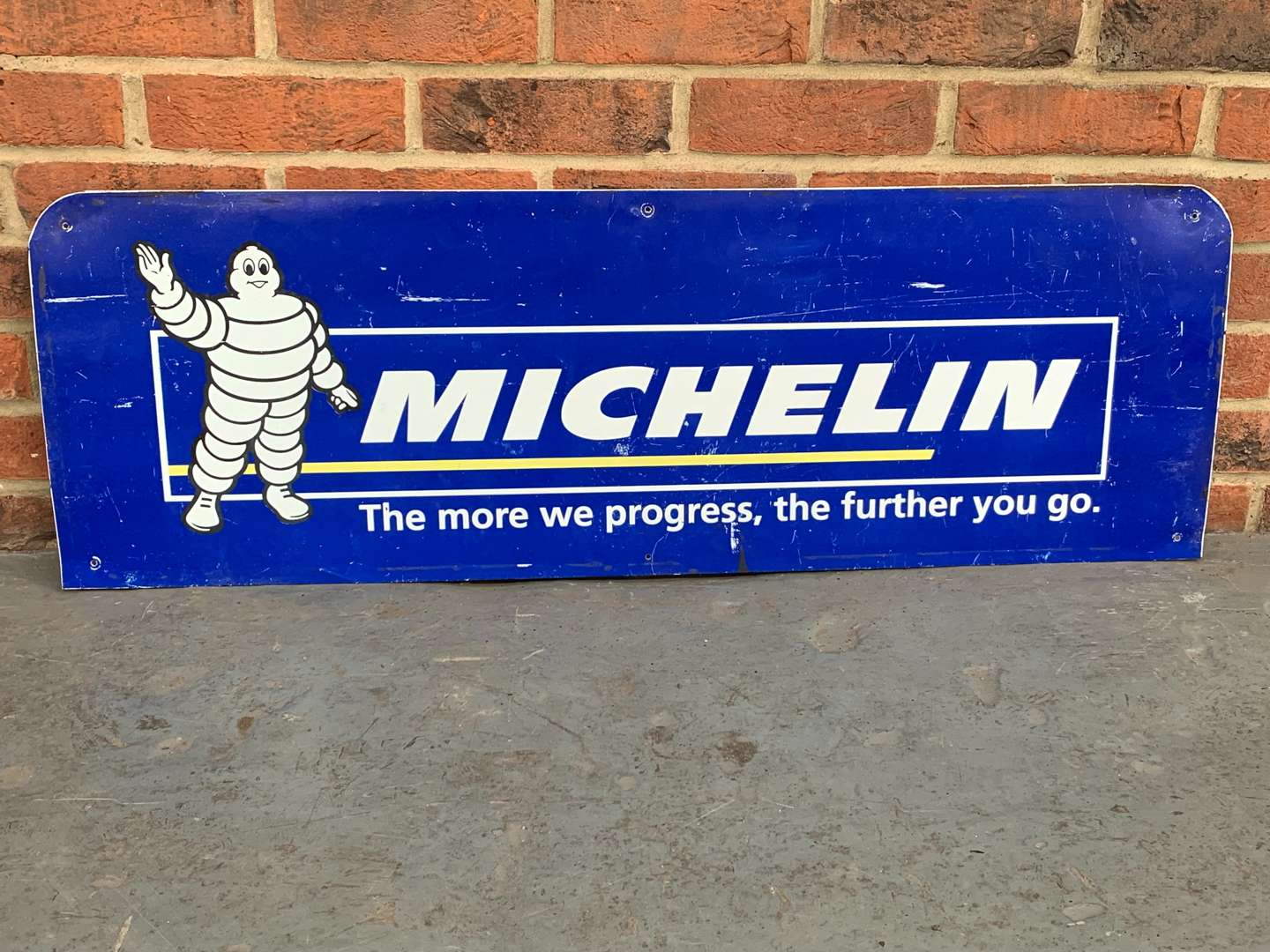 <p>Michelin “The More We Progress” The Further You Go Sign</p>