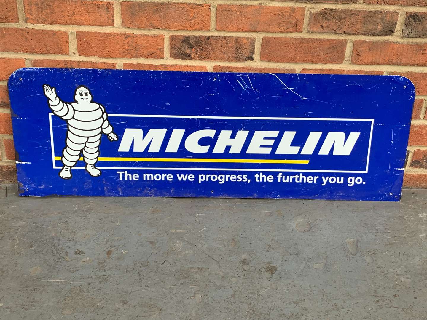 <p>Michelin “The More We Progress” The Further You Go Sign</p>