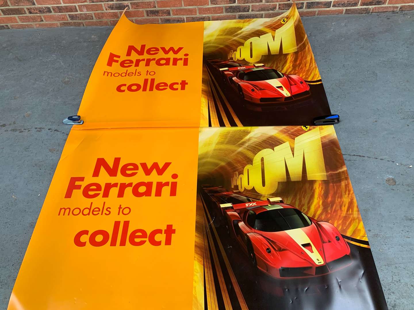 <p>Two Plastic Ferrari Posters</p>