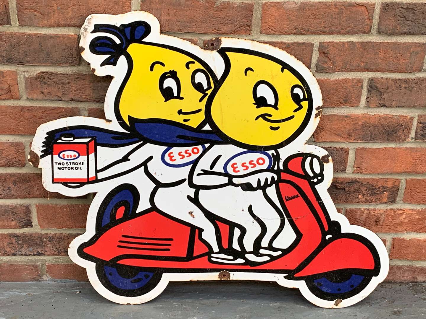 <p>Enamel Mr and Mrs Drip on a Scooter Sign</p>