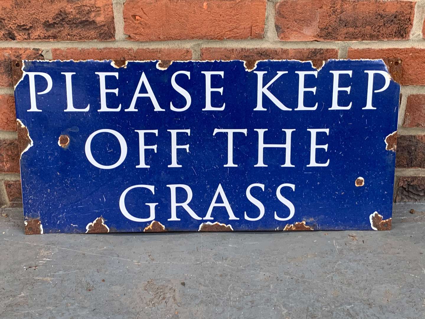 <p>Enamel “Please Keep Off The Grass” Sign</p>