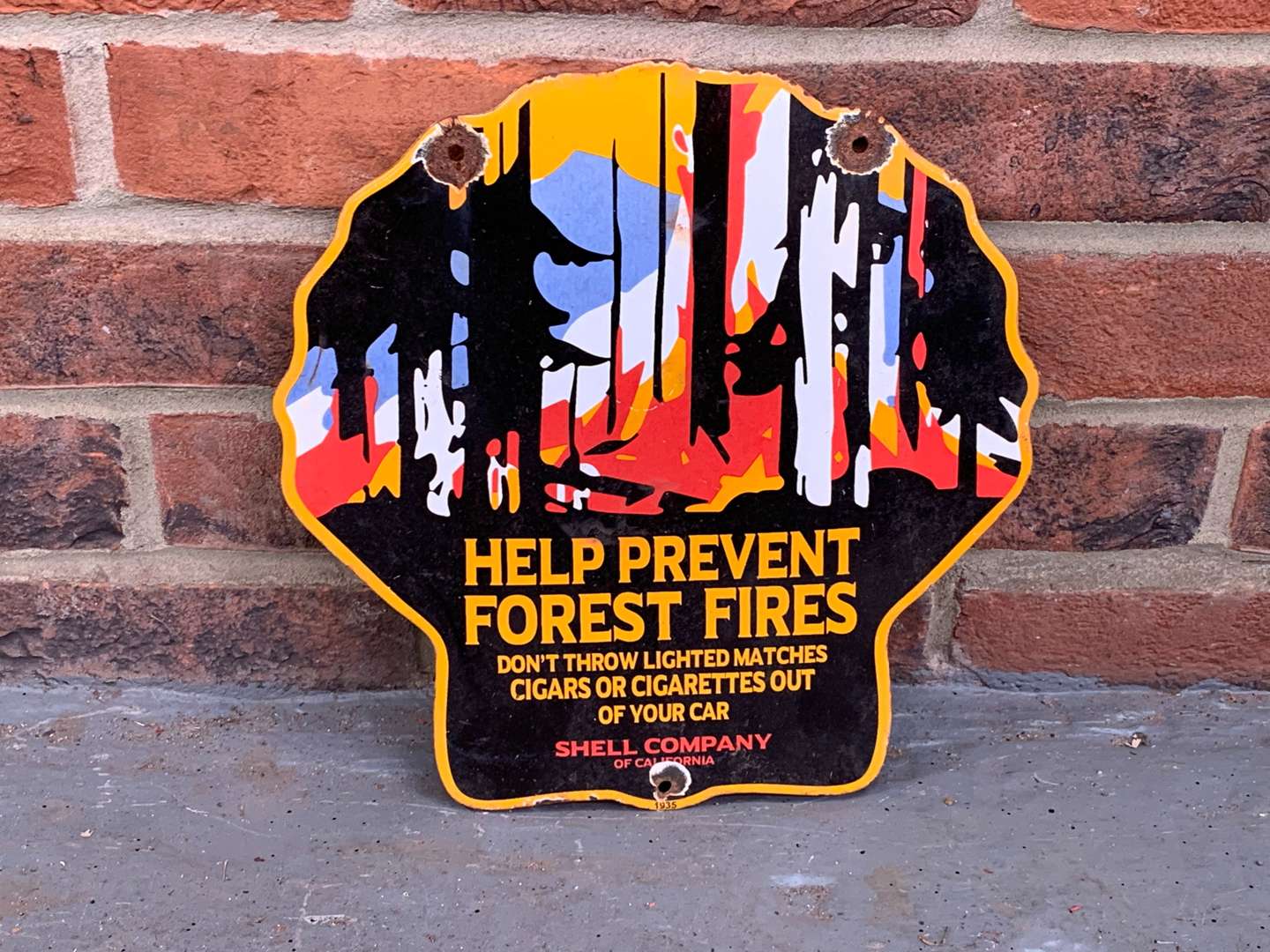 <p>Enamel Shell Shaped “Help Prevent Forest Fires” Sign</p>