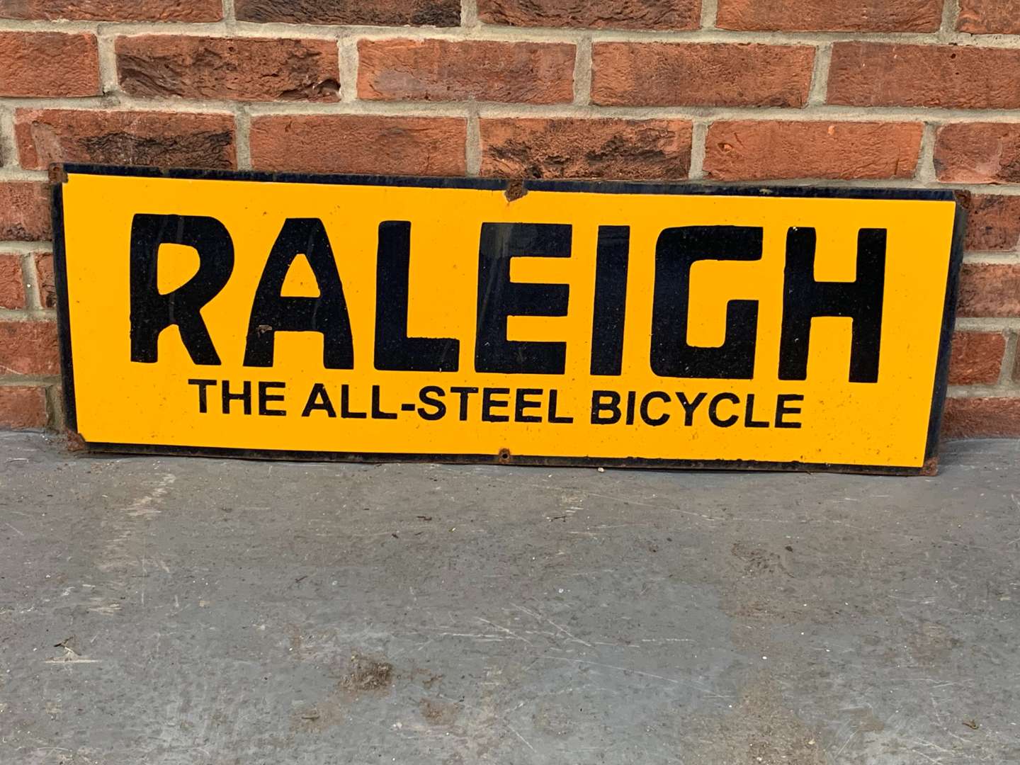 <p>Enamel Raleigh The All Steel Bicycle Sign</p>