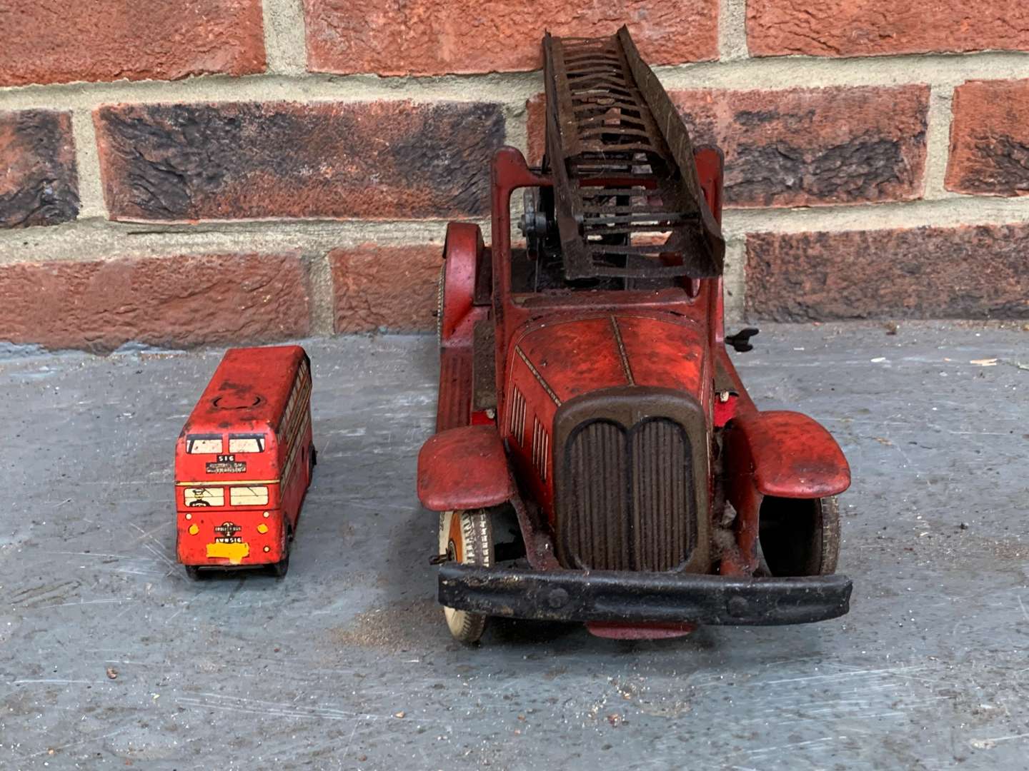 <p>Vintage Tin Plate Clockwork Fire Engine and Double Decker Bus (2)</p>