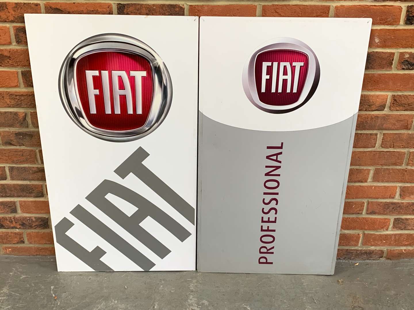<p>Two Fiat Dealership Signs</p>