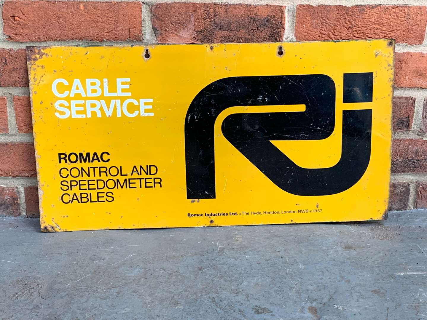 <p>Tin Romac Cable Service Sign</p>