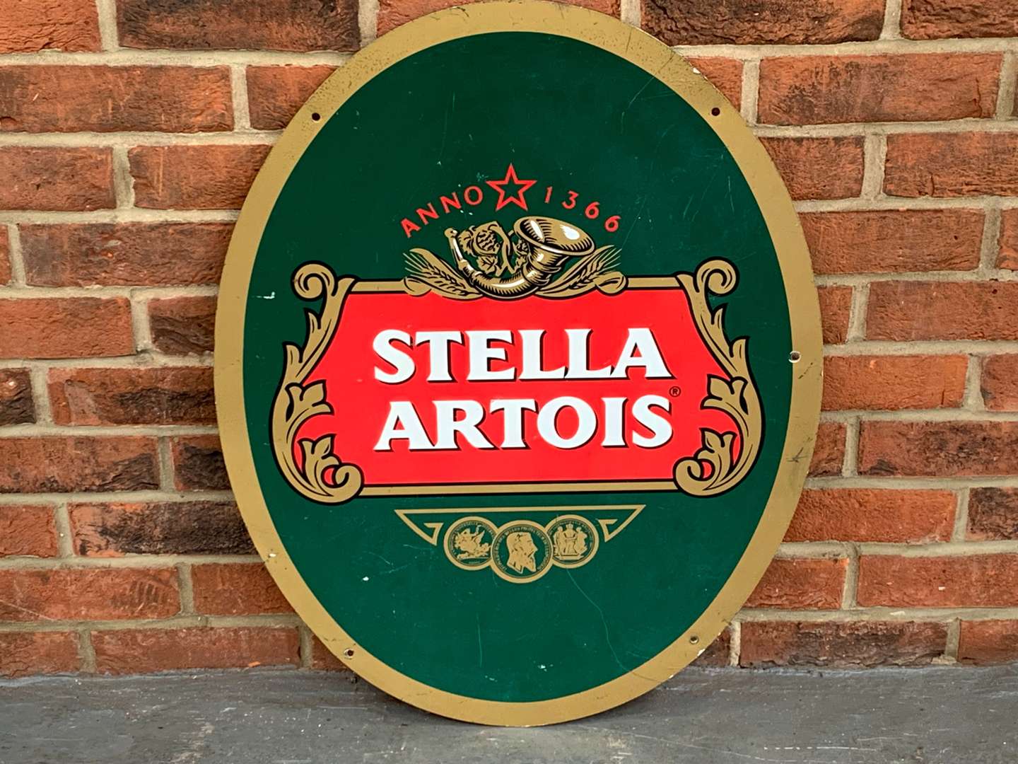 <p>Metal Oval Stella Artois Sign</p>