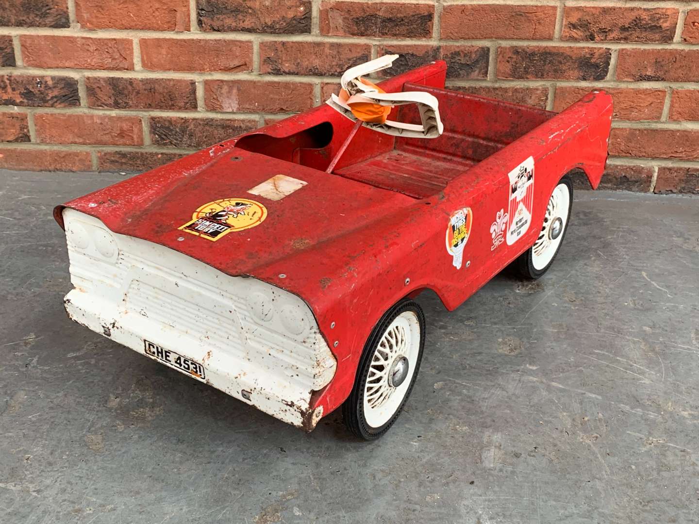 <p>Red Tin Plate Childs Pedal Car</p>