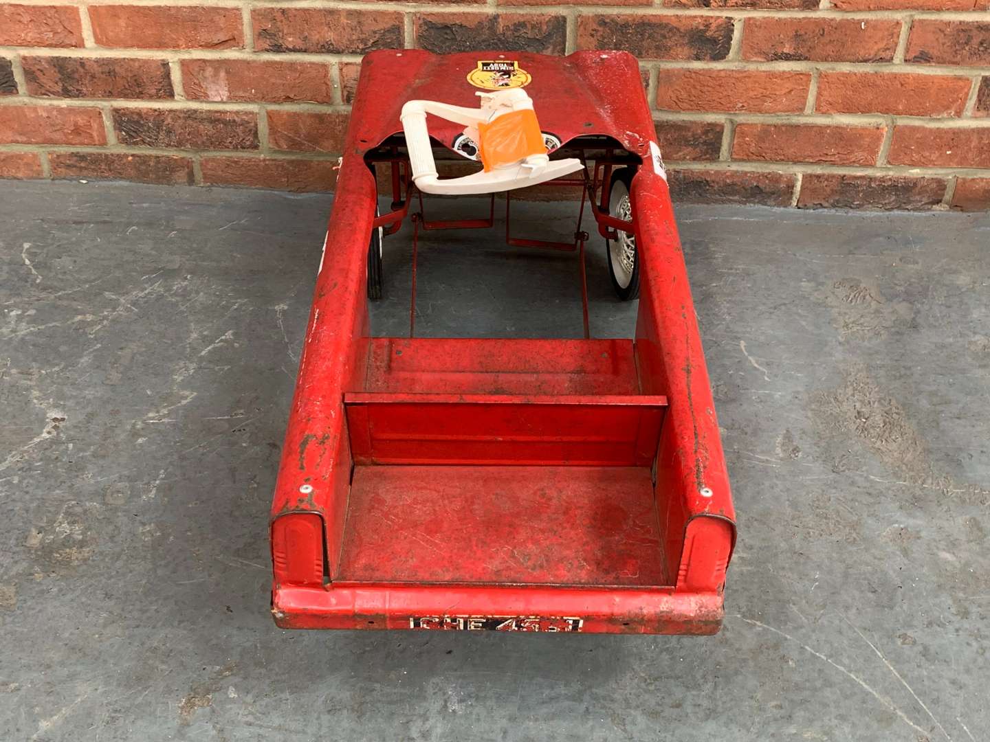<p>Red Tin Plate Childs Pedal Car</p>