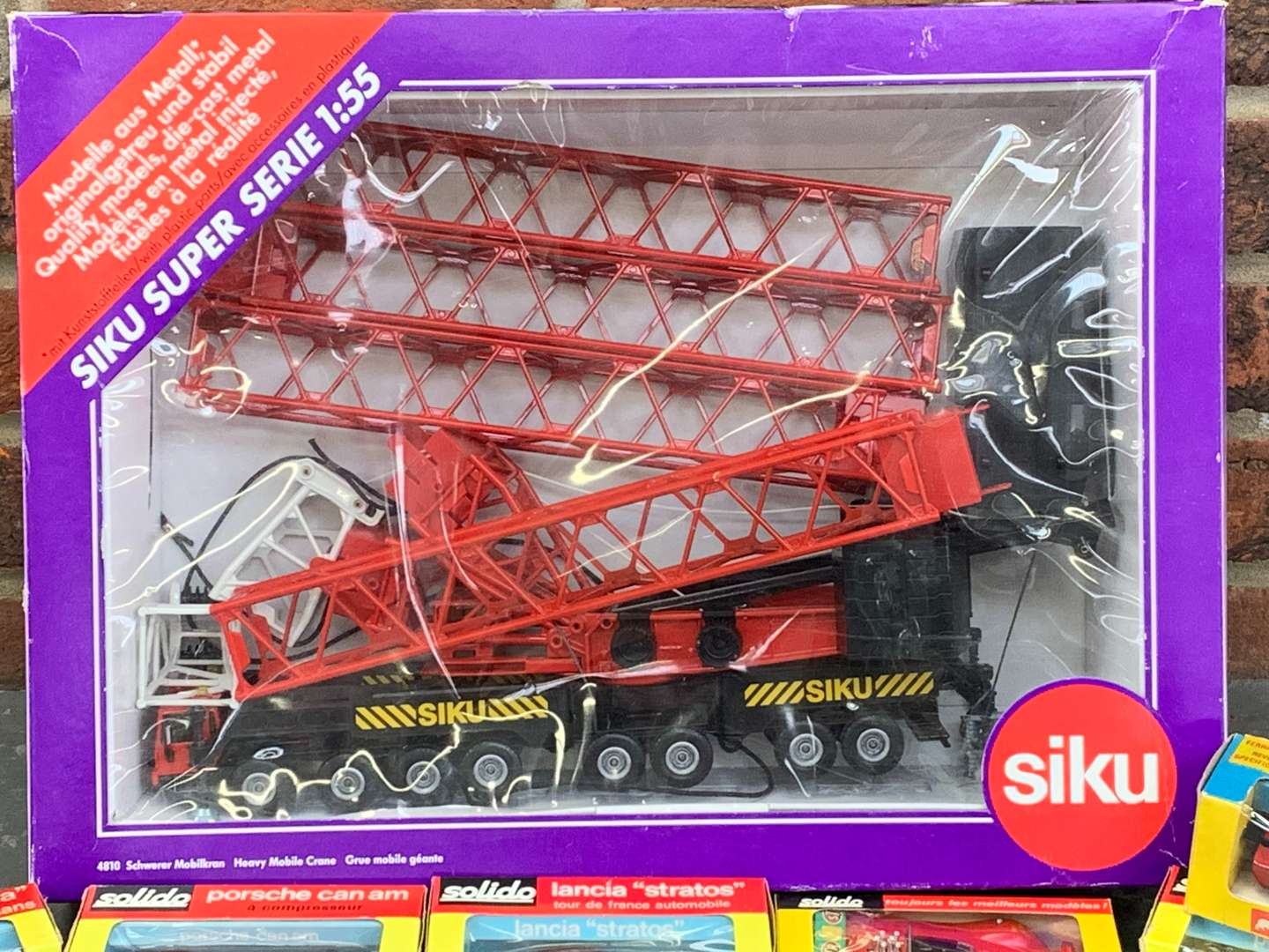 <p>Boxed Siku Model Crane and Six Die Cast Cars</p>