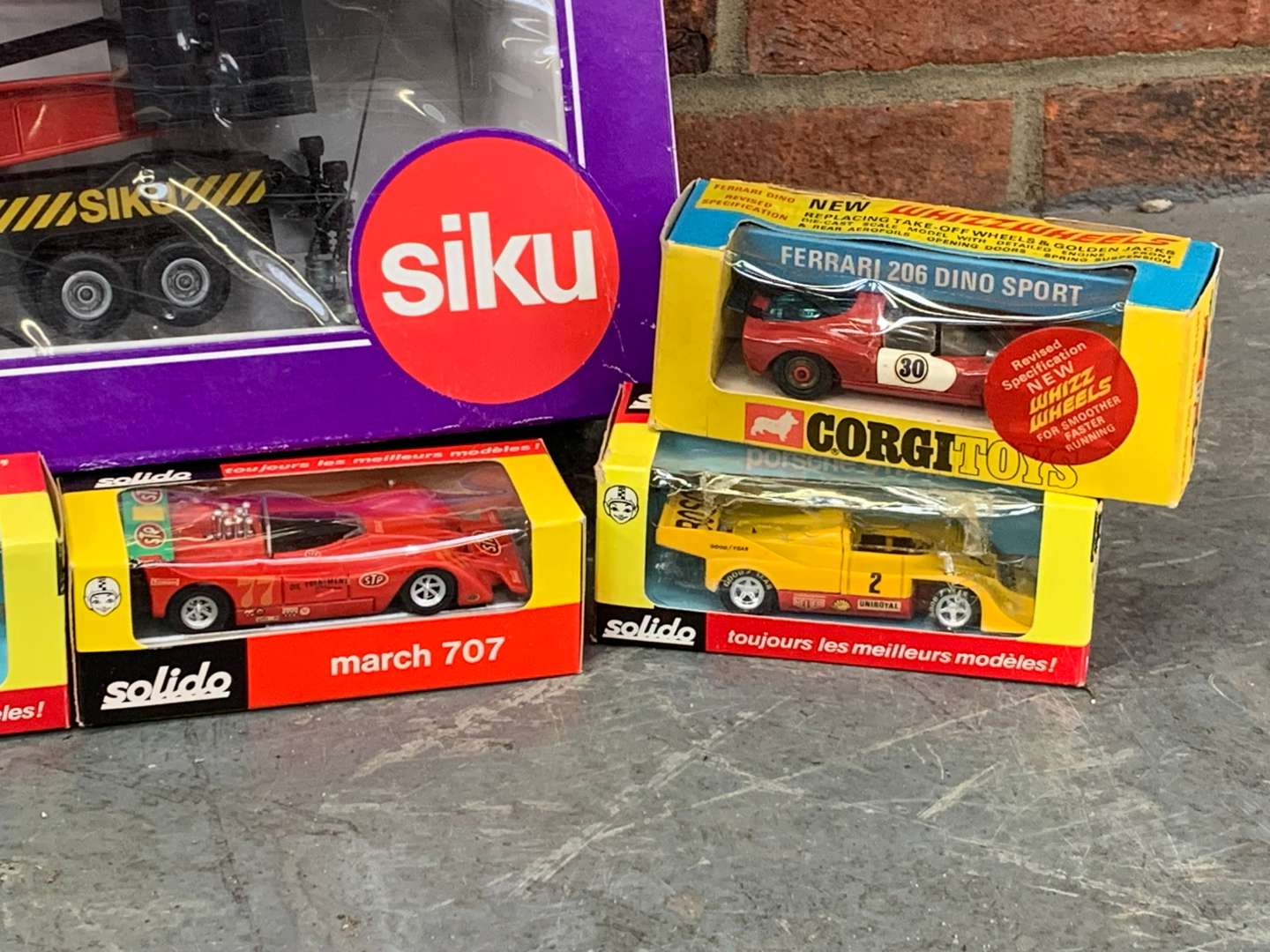 <p>Boxed Siku Model Crane and Six Die Cast Cars</p>