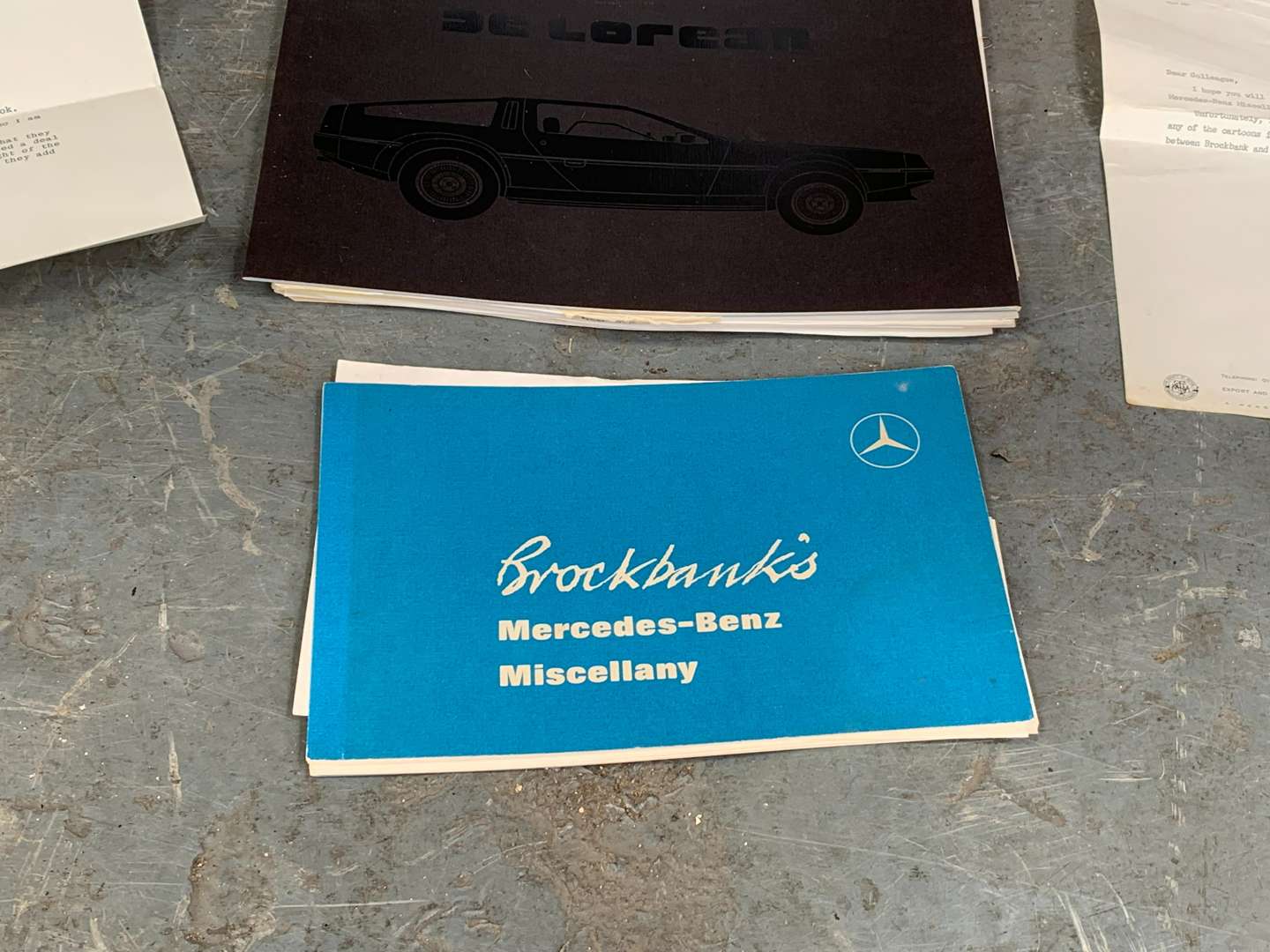 <p>DeLorean Booklet and Mercedes Paperwork</p>