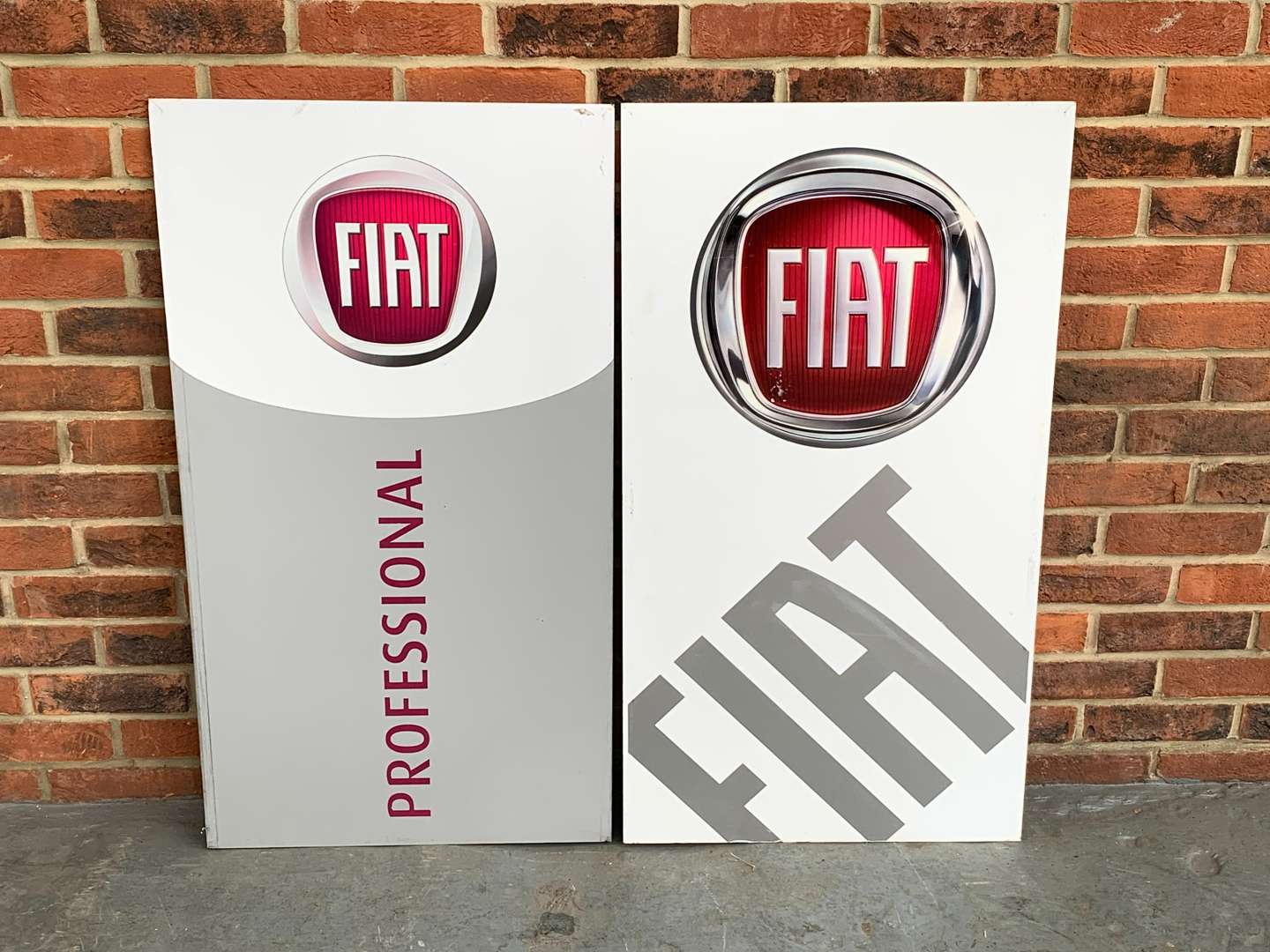 <p>Two Metal Fiat Dealership Signs</p>