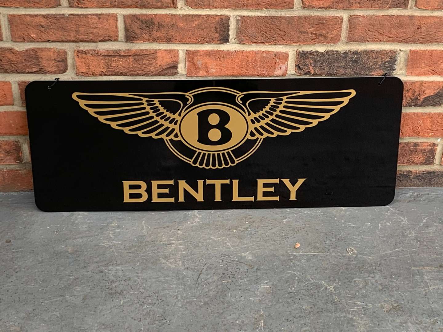 <p>Modern Metal Bentley Hanging Sign</p>
