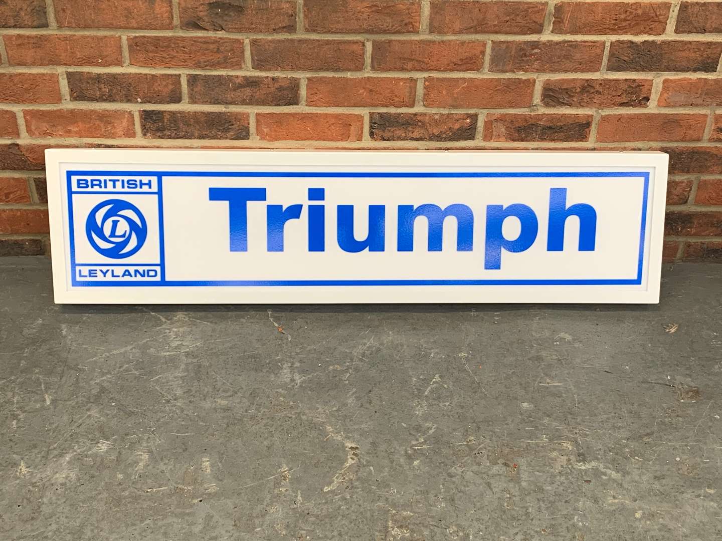 <p>Modern Metal Framed Triumph Illuminated Sign</p>
