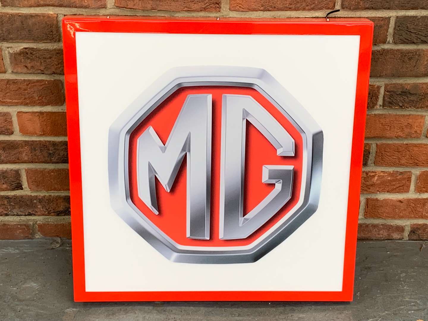 <p>Modern Metal Framed MG Illuminated Sign</p>