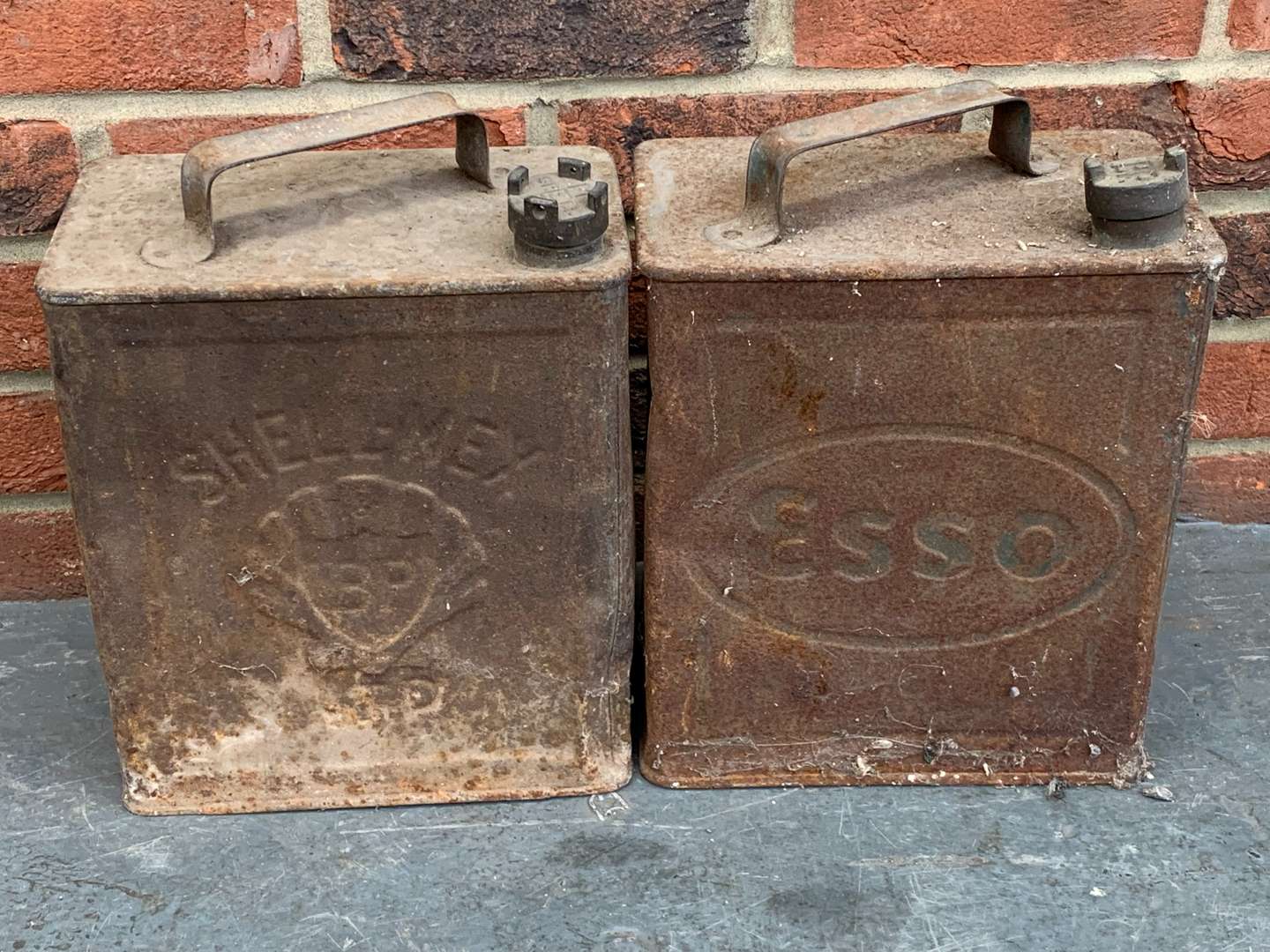 <p>Two 2 Gallon BP and Esso Petrol Cans</p>