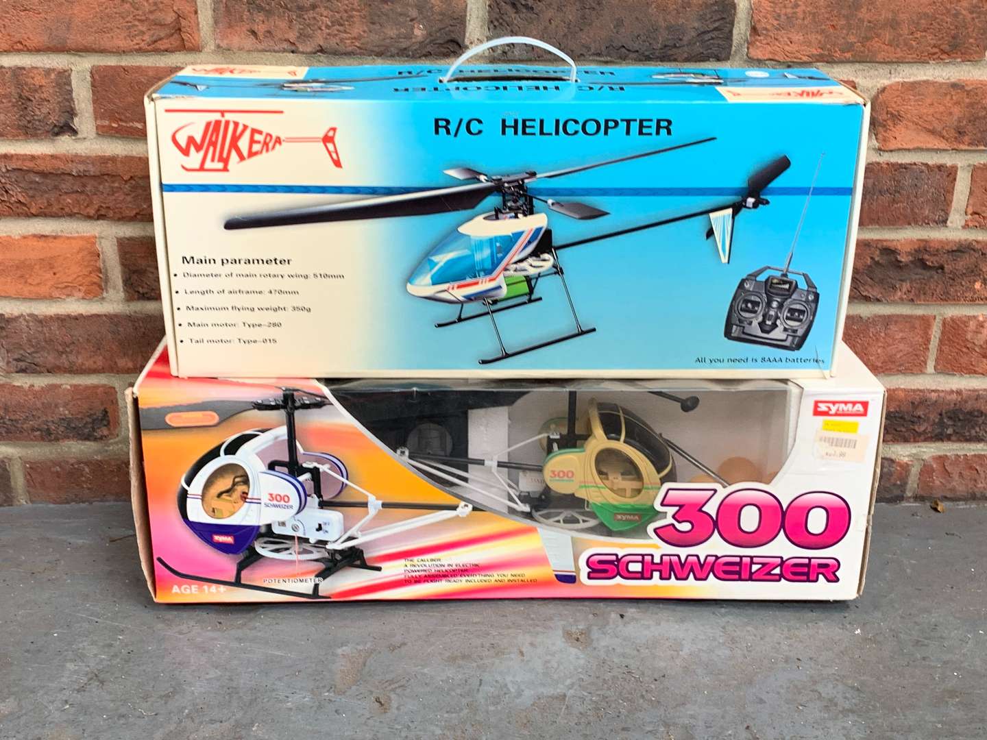 <p>Two Boxed Remote Controlled Helicopters&nbsp;</p>