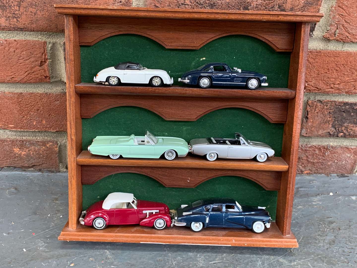 <p>Display Case of Six Die Cast Model Cars</p>
