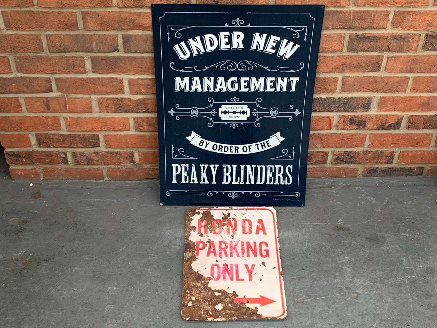 <p>Modern Metal Honda Parking and Peaky Blinders Sign</p>