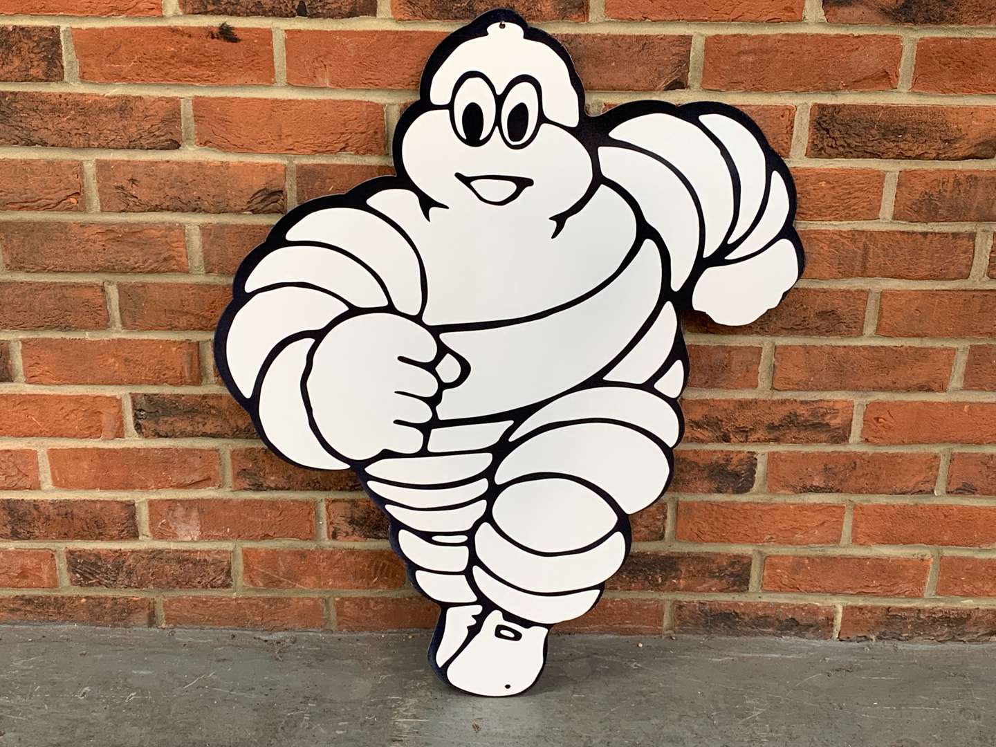 <p>Metal Michelin Running Man Sign</p>