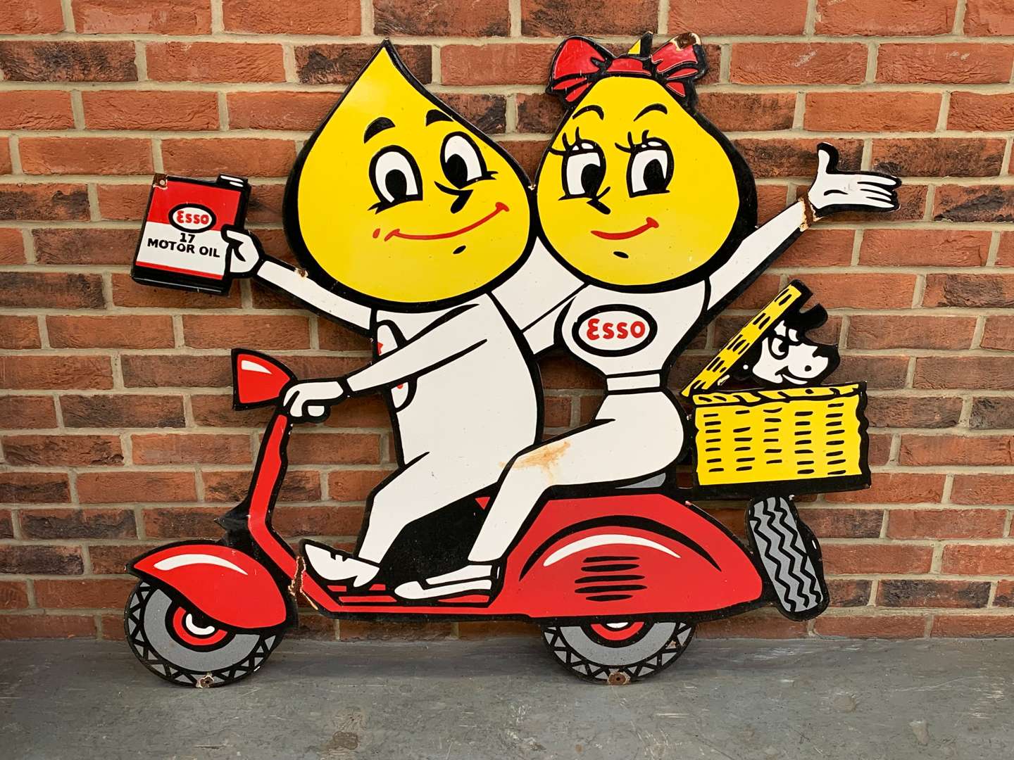 <p>Large Enamel Mr and Mrs Drip on a Scooter Sign</p>