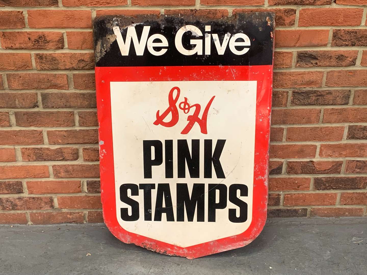 <p>Metal We Give Pink Stamps Shield Sign</p>