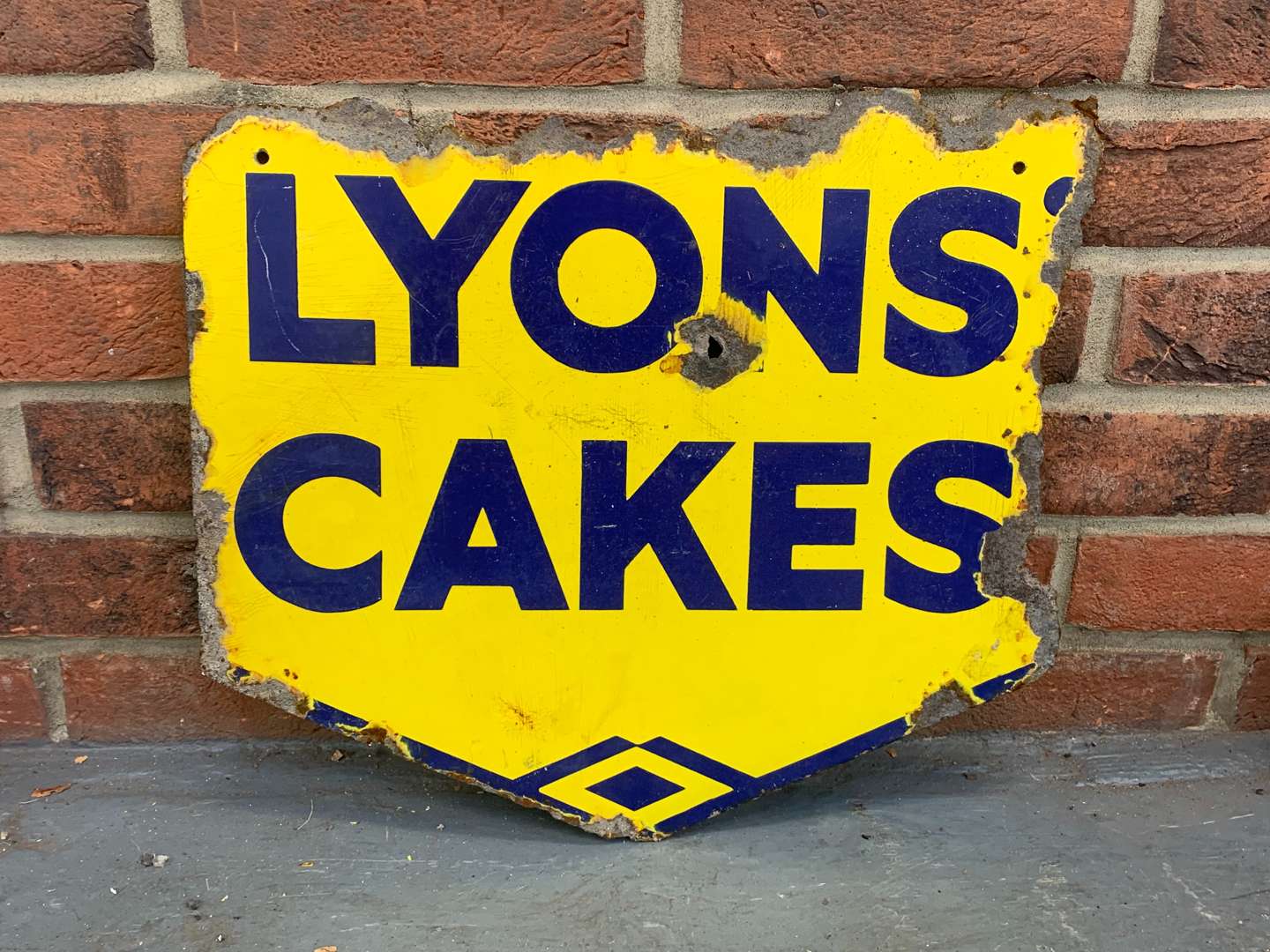 <p>Lyons Cake Enamel Sign</p>